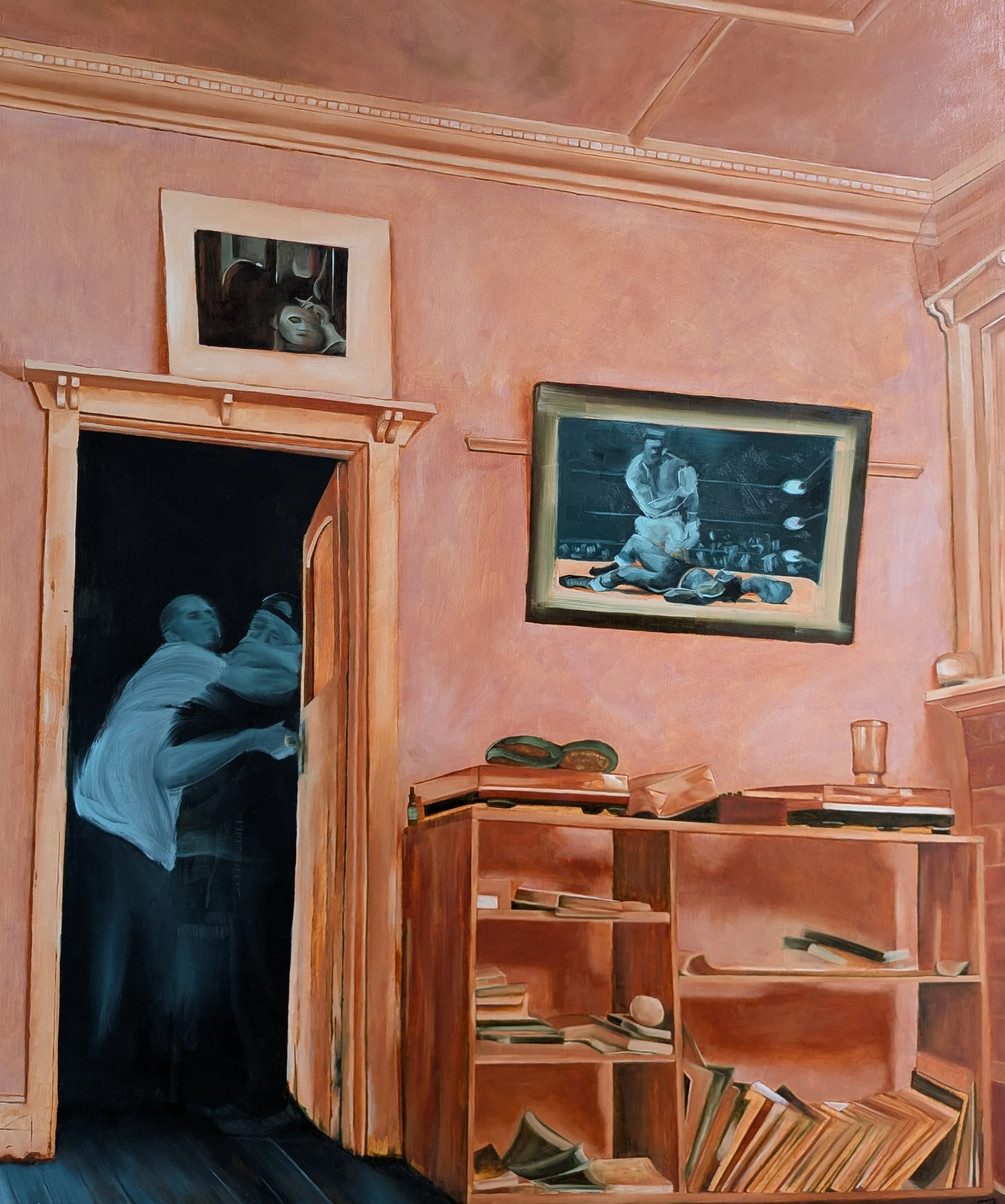Interior of a room with peach-colored walls, wooden ceiling, and wooden shelves filled with books. There are two framed pictures on the walls: one of a woman in black and white, and a larger one of a man playing golf. A person with long hair is taking a photo in a mirror, wearing a light-colored top.