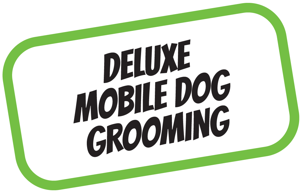Sign for deluxe mobile dog grooming with green border and black text.