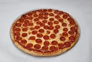 Pepperoni pizza on a white surface