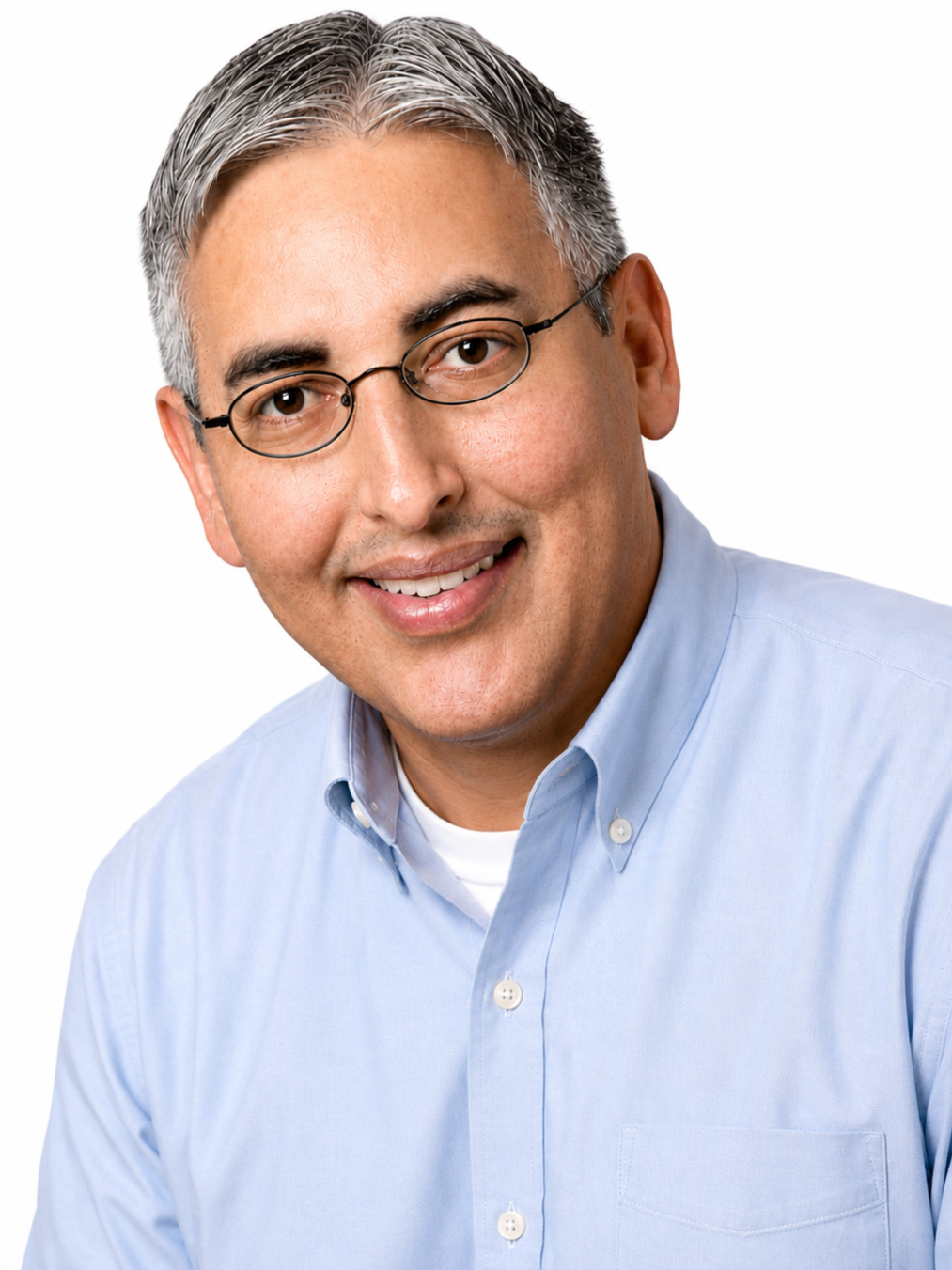 Robert Collins A smiling middle-aged man with gray hair, wearing glasses, a light blue button-up shirt, and a white t-shirt underneath, posing against a plain white background.