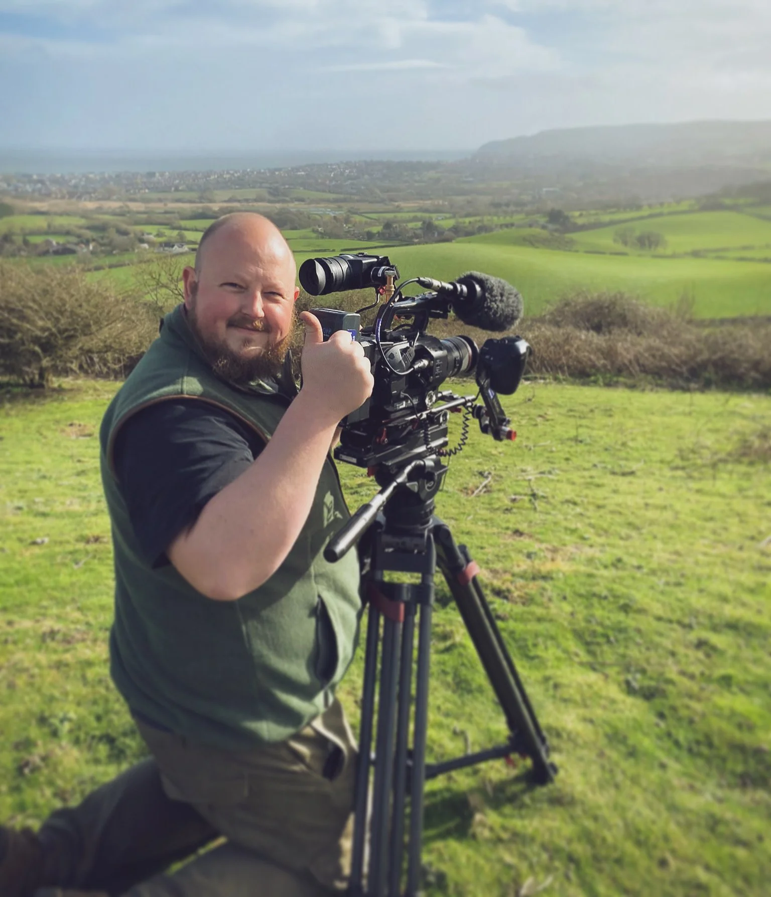 Ben Seale, founder of Directed by Good, filming on location. A documentary filmmaker with a background in broadcast television, creating human-centred stories for heritage, culture and purpose-driven organisations.