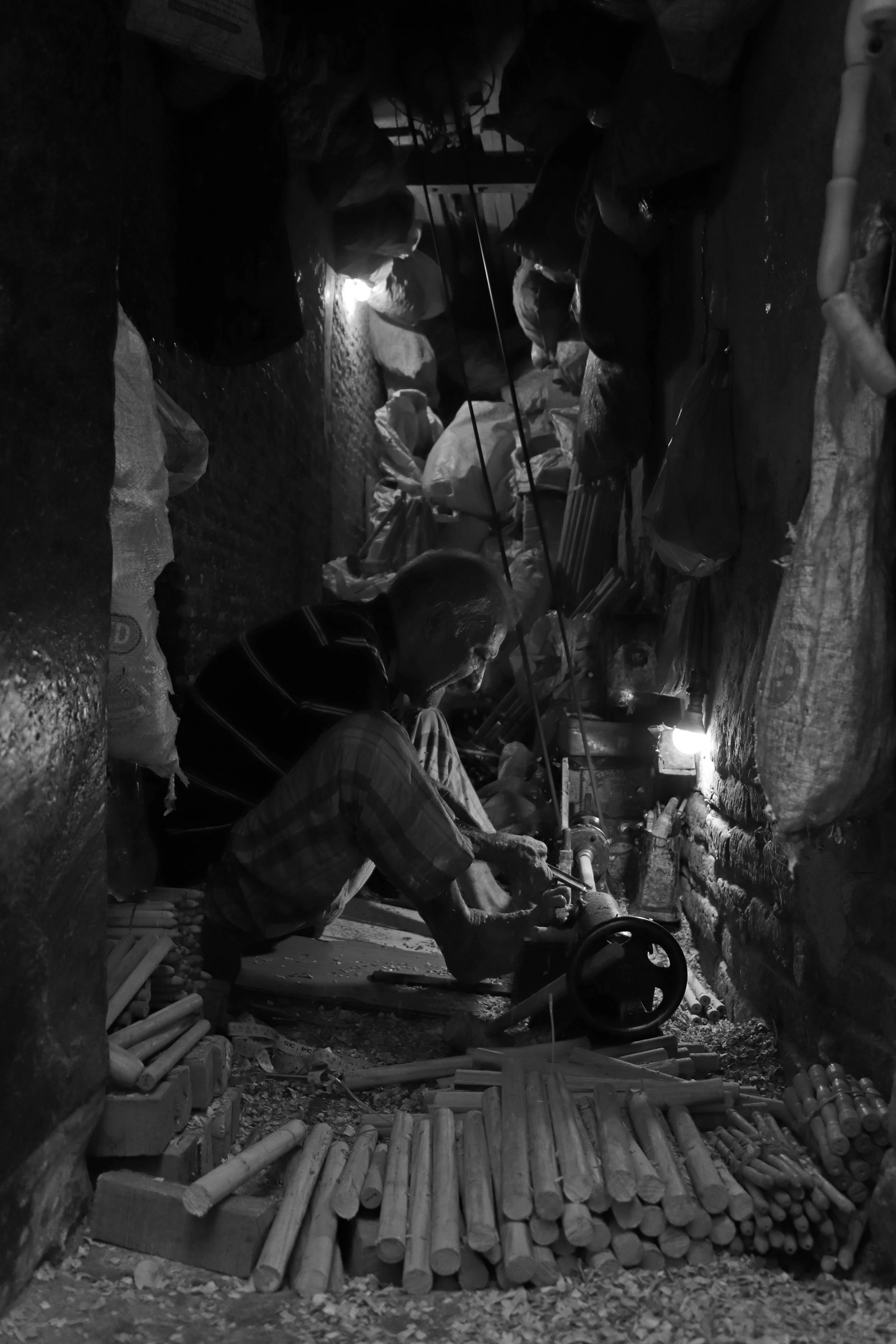Wood craftman in a dingy room.jpg