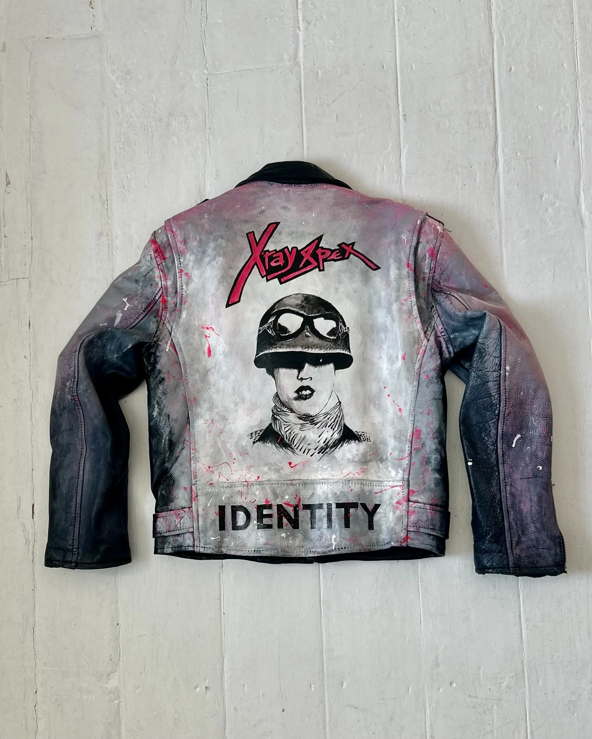 It's a crisis can't you see? Poly Styrene - X-Ray Spex. Formed from a reclaimed vintage leather jacket - acrylic leather paint - the detritus and debris of everyday life - hand-applied studs - classic vintage button badges - memories and thoughtfully