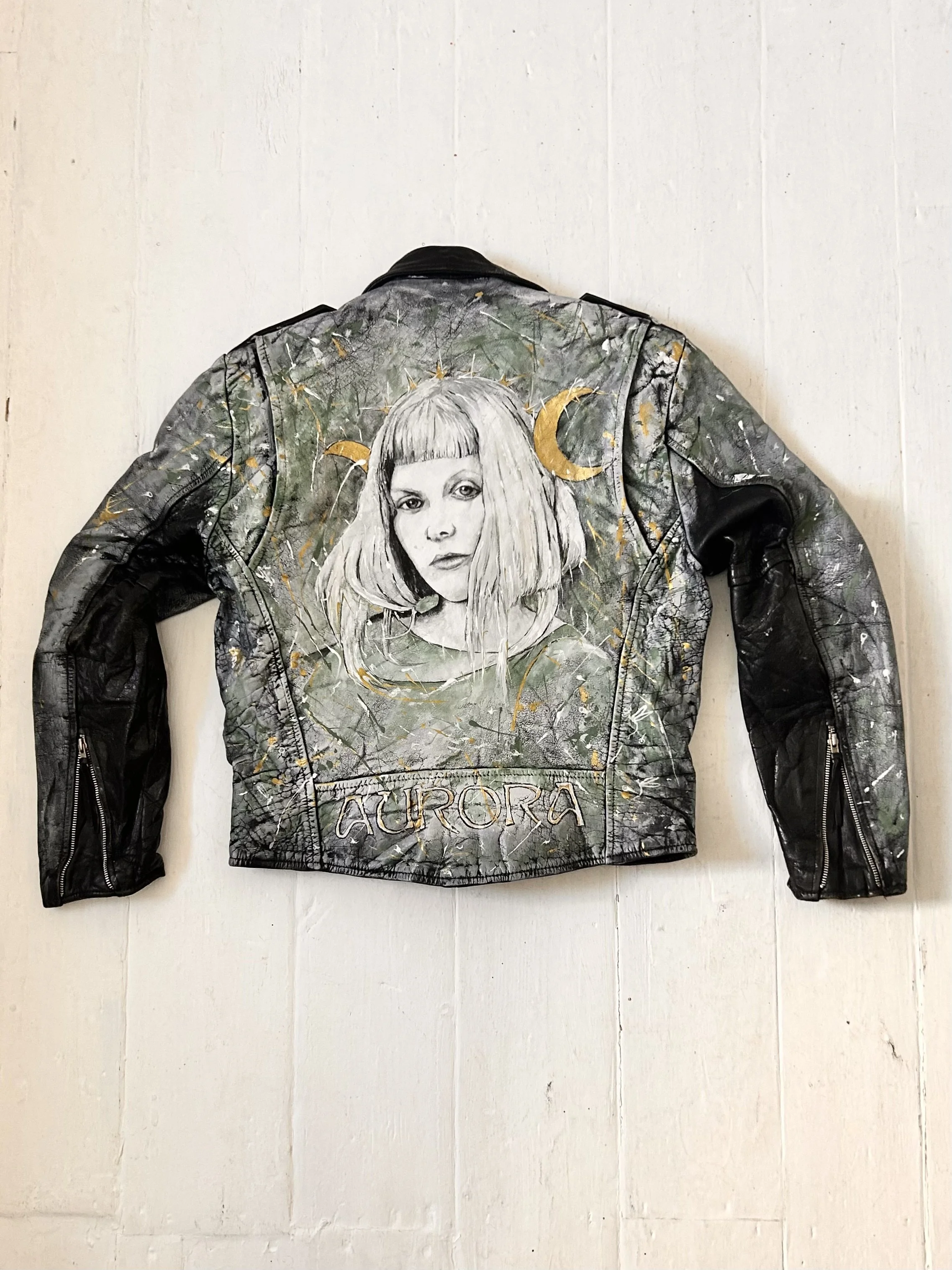 Nature has been my secret lover for a long time. Aurora Aksnes

Subject - Aurora Aksnes - Arrived in this world 15th June 1996 – Stavanger, Norway

Vintage leather jacket - Acrylic leather paint, studs, detritus of life, vintage butterfly brooch.

Da