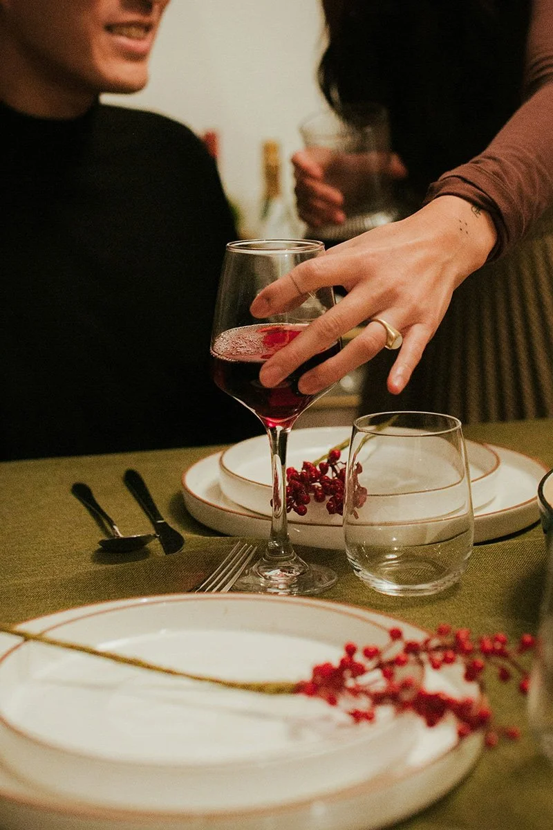 Close up of dinner table with plates and wine tasting