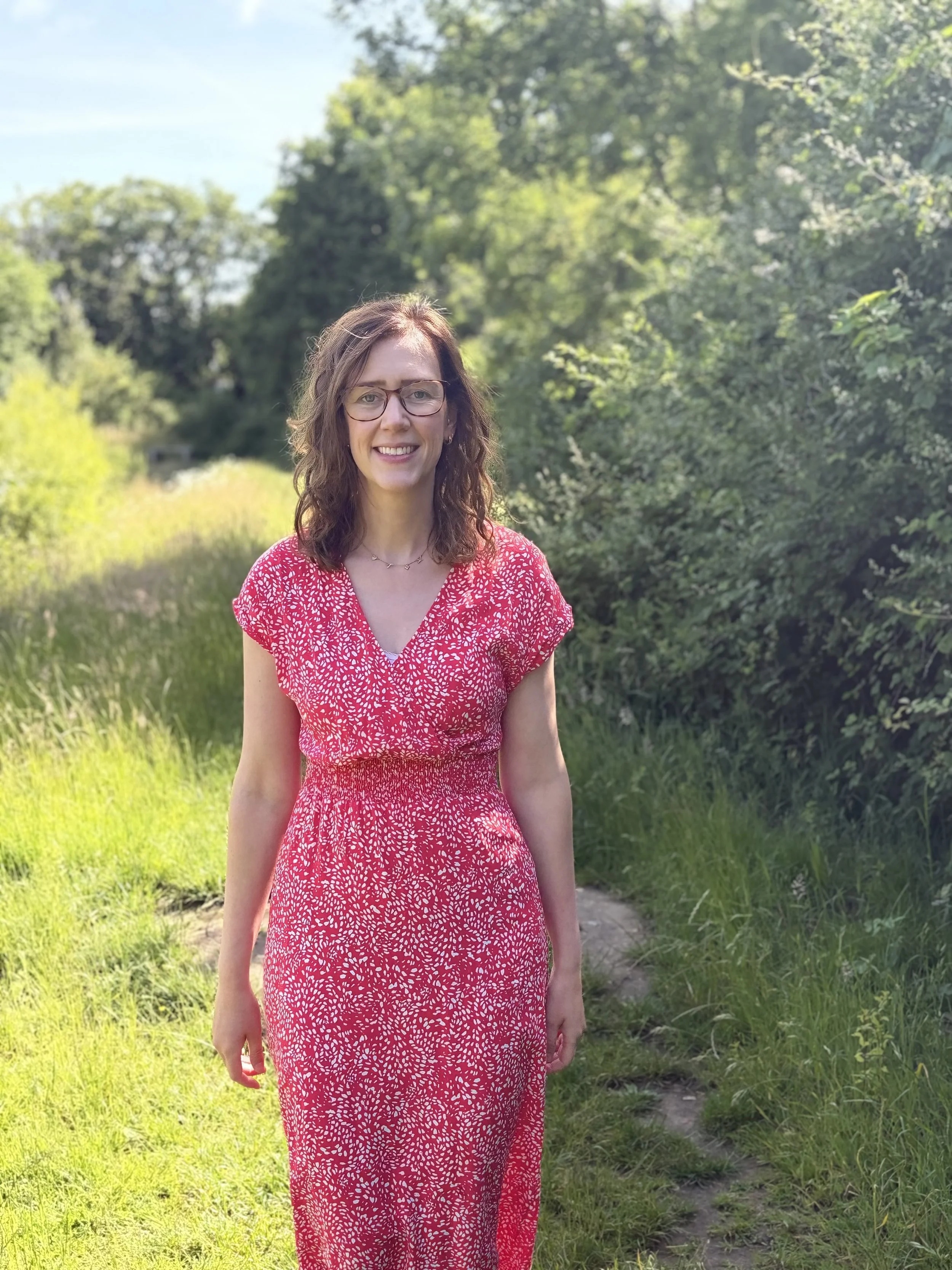 Hypnotherapist relaxed walking in meadow