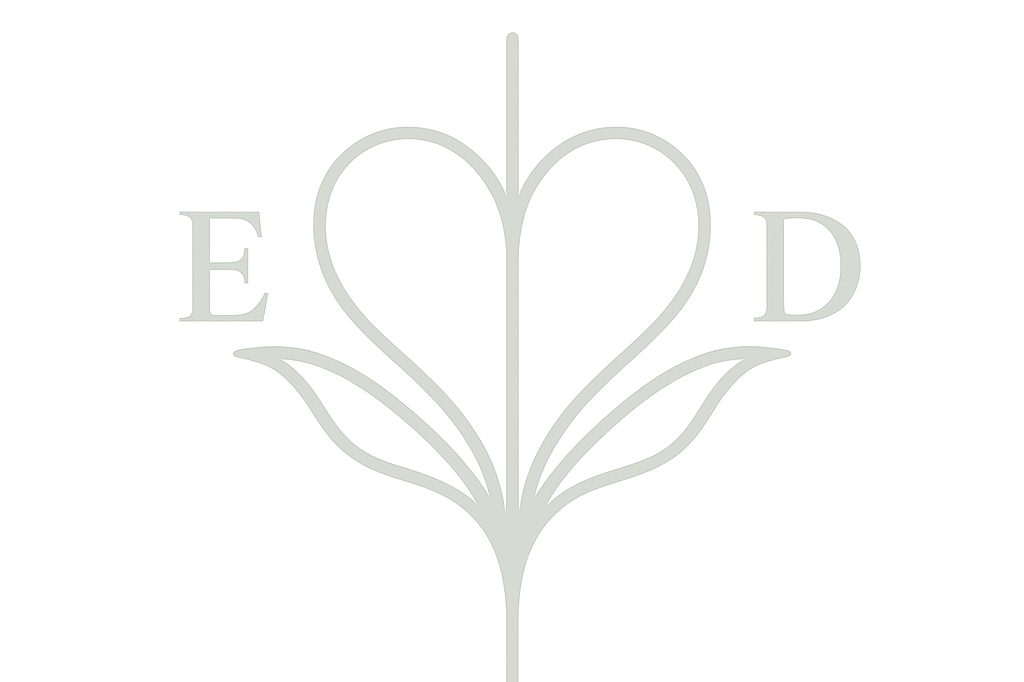A logo featuring a flower with a heart-shaped petal in the center, and the letters E on the left and D on the right, connected by stylized leaves.