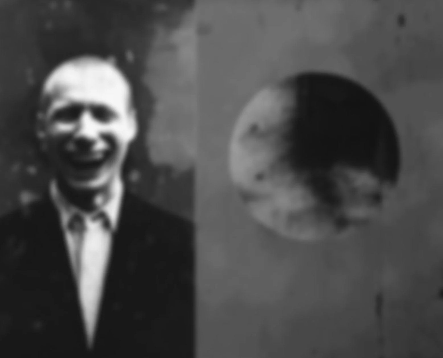 The blurred and somehow irritating face of a political clown, presumably an officeholder joker, snickers perniciously at one of the taxpayers they are robbing blind with a sickening sense of self delight.  This black-and-white graphic haunts.