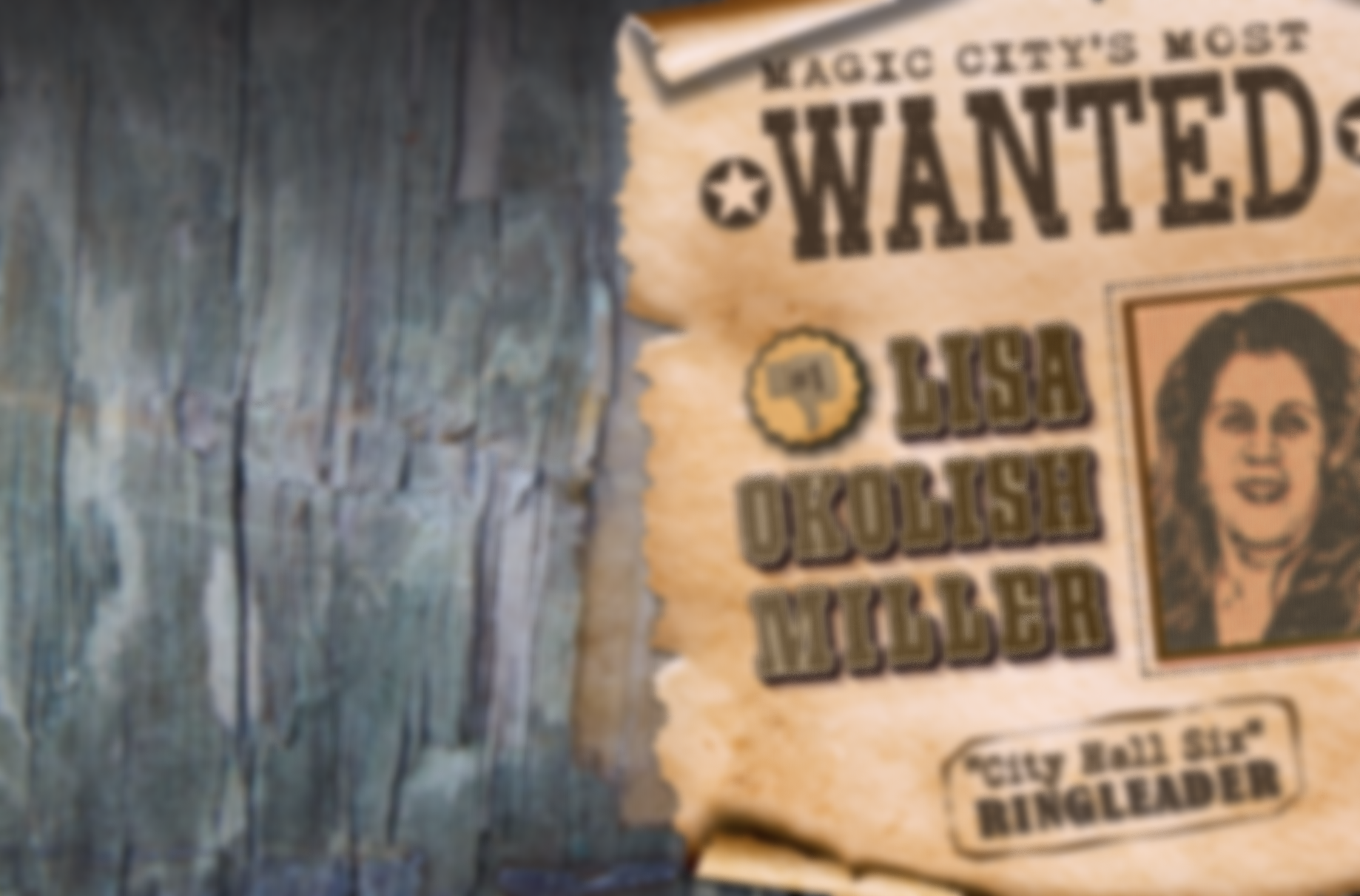 Nailed into a background of grey, textured wood, a slightly out-of-focus WANTED poster curls at the edges and pronounces Law Director LIsa Miller the ringleader of the "City Hall Six" who voted to oust Mayo Judge for no reason; Western vibes abound.