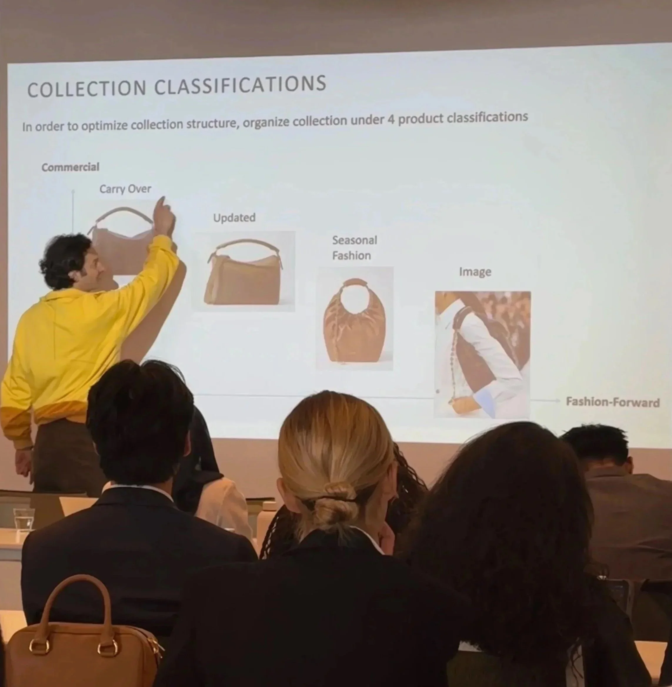 David Berliet delivering a product merchandising strategy training for fashion professionals.