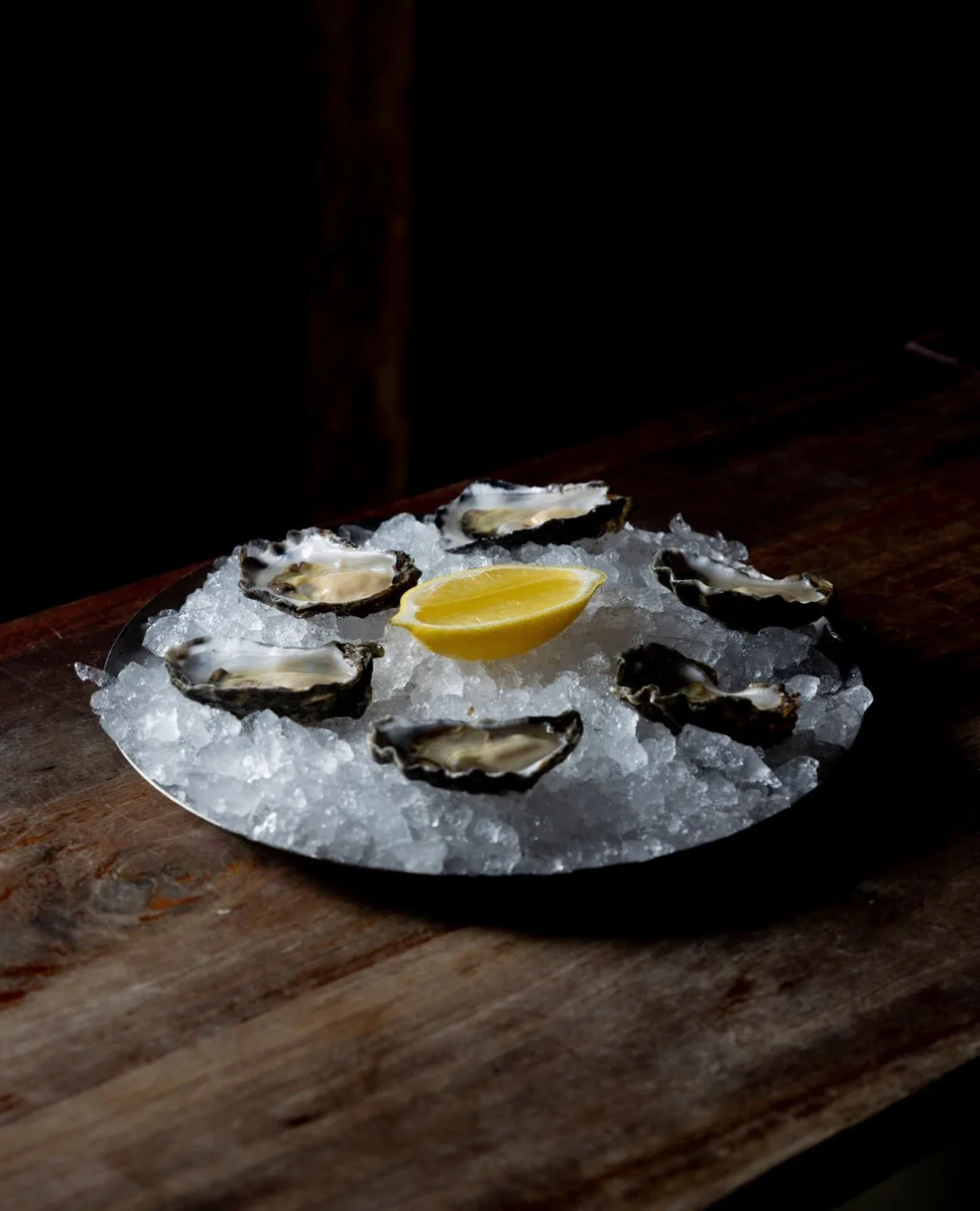 You order them, we&rsquo;ll shuck them. Live oysters. Mignonette. Lemon. Ice cold.