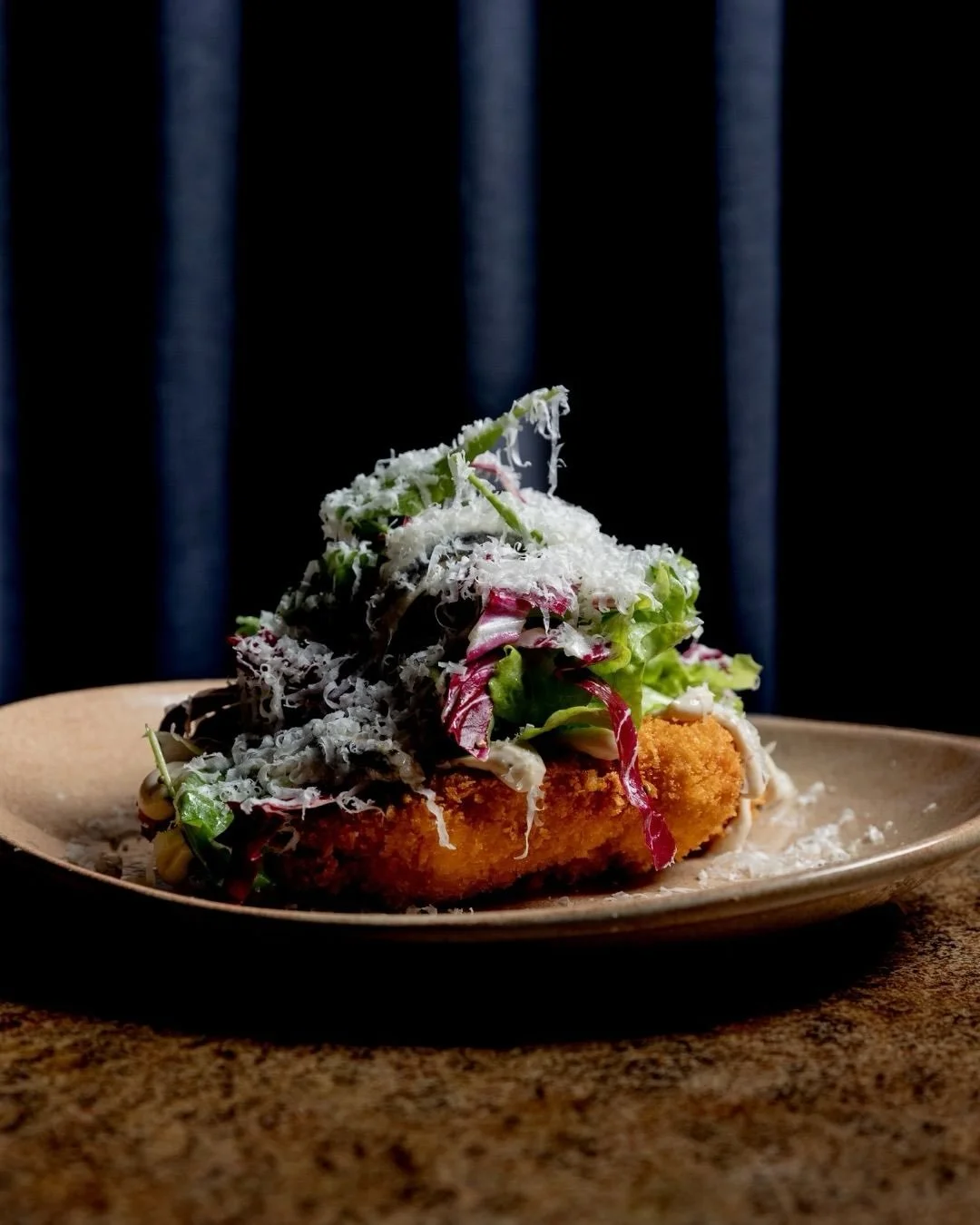 A Glenelg favourite.
Chicken schnitzel. 
Farm leaf Caesar, pecorino, anchovies.