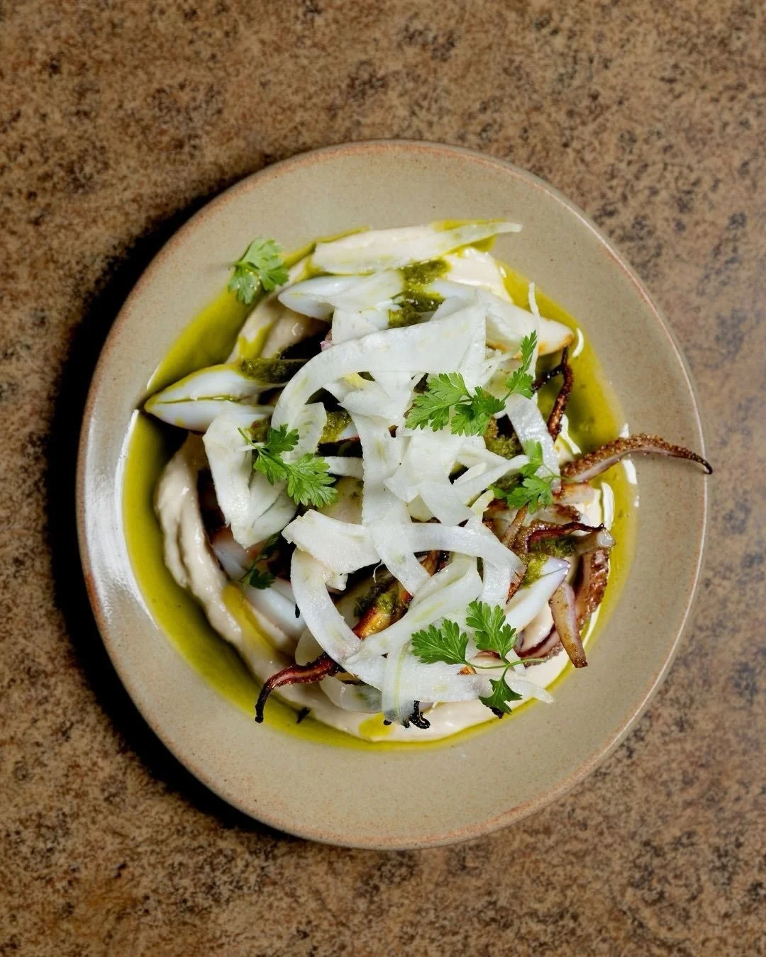 Smokey, buttery, straight off the grill.

Grilled calamari with bagna c&agrave;uda, fennel and chimichurri.
