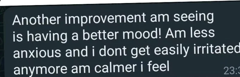 Text message about improved mood, feeling less anxious, and calmer.