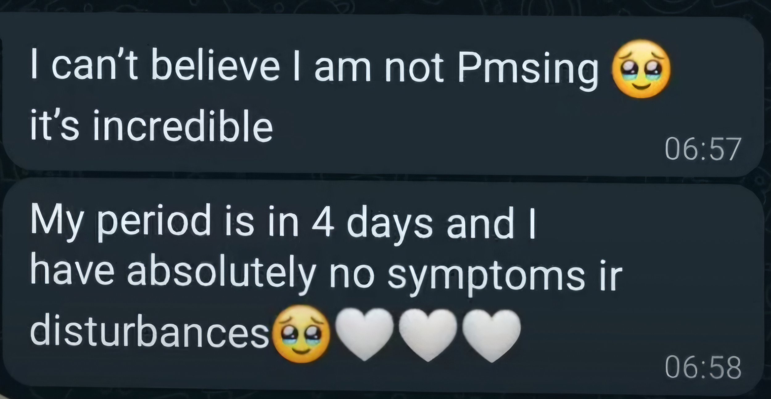 A screenshot of a message thread expressing disbelief about not PMSing, with a crying and smiling emoji, and a comment about having no symptoms before a period, accompanied by heart emojis.