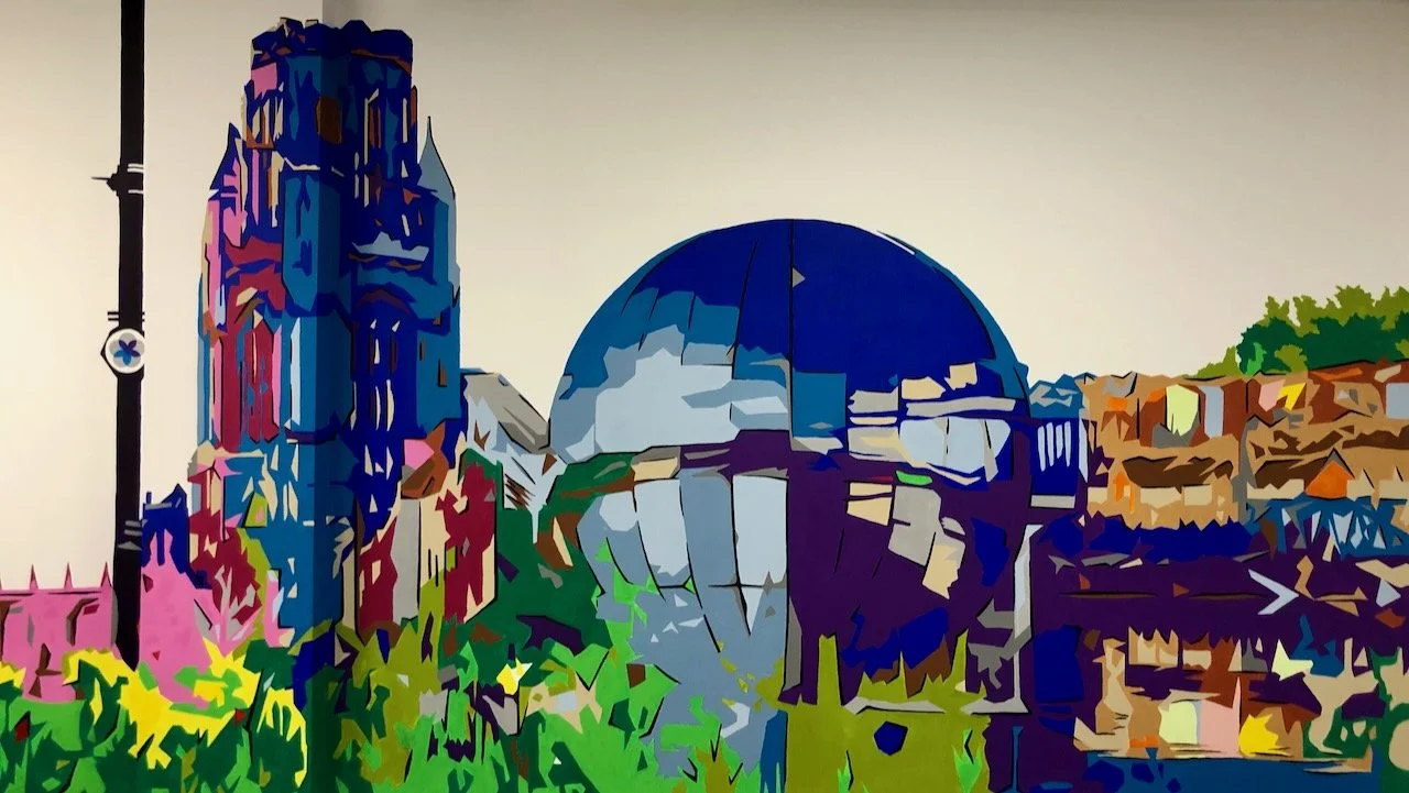 Colorful, abstract illustration of the Griffith Observatory in Los Angeles with surrounding buildings and greenery.