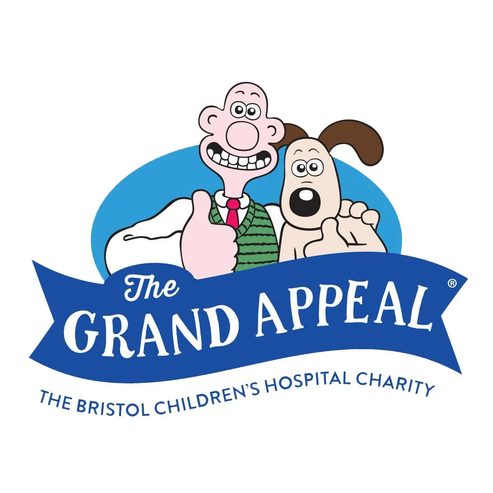 Logo for The Grand Appeal, a charity supporting Bristol Children's Hospital, featuring cartoon characters from The Simpsons including Homer and Santa's Little Helper.