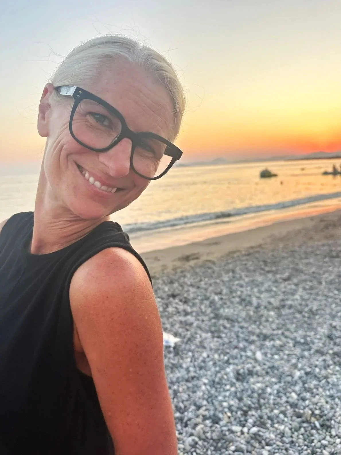 Eleanor Lestrange - Founder of she’s got AGENCY & Co-founder of girls ALIVE woman in her 50s with blond hair and bold frame glasses