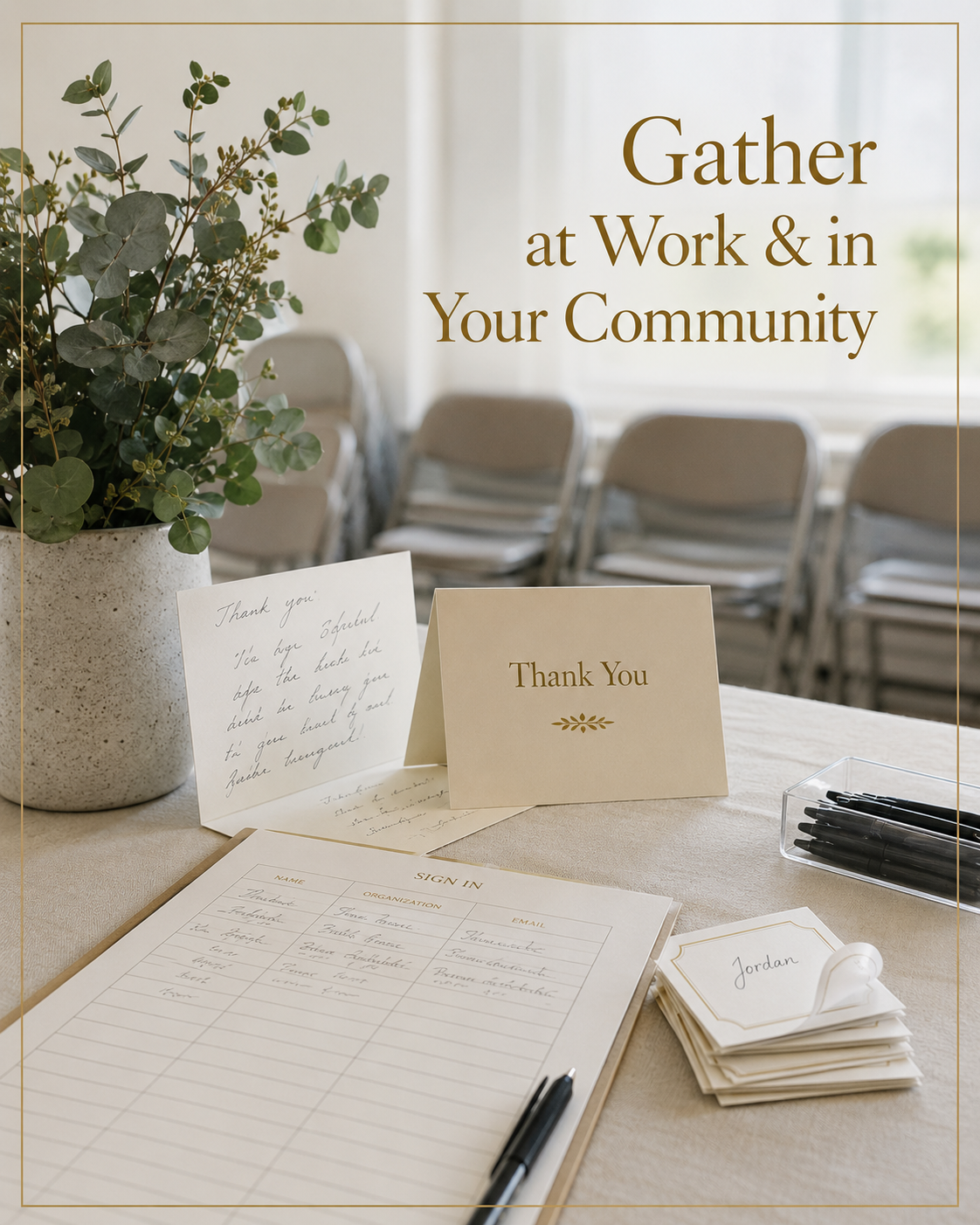 A table with a potted plant, a thank you card, handwritten notes, a sign-in sheet, and name tags, in a meeting or event setting with chairs in the background.