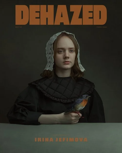 Cover of Dehazed magazine featuring a young woman with fair skin, red hair, wearing a black quilted garment and a lace head covering, holding a bird with brown, orange, and blue feathers, against a dark background. The title "DEHAZED" is at the top in large orange letters, with the name "Irina Jefimova" in orange at the bottom.