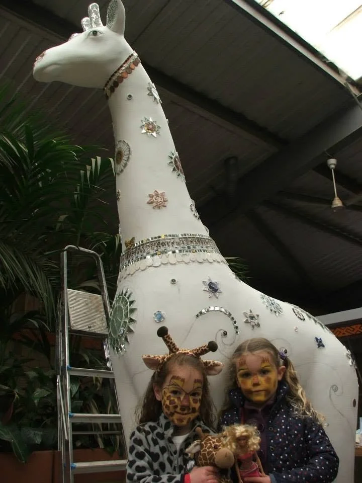 giraffe-with-girls.jpg