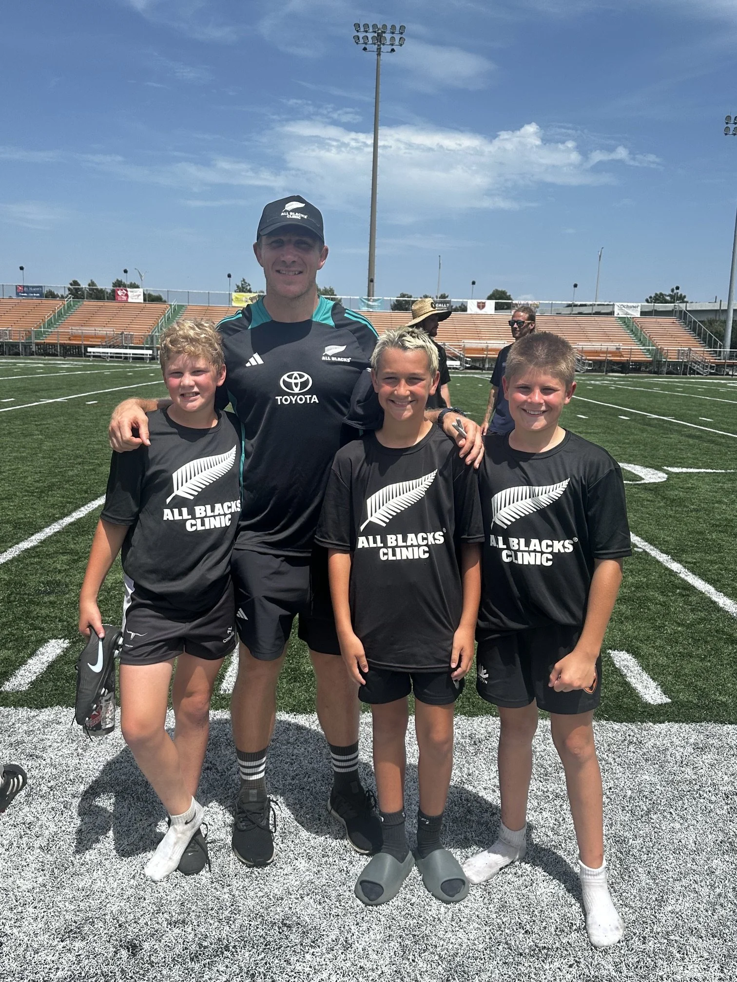 Three Austin Blacks Youth players posing for a photo after the All Blacks Summer Camp Clinic in New Orleans