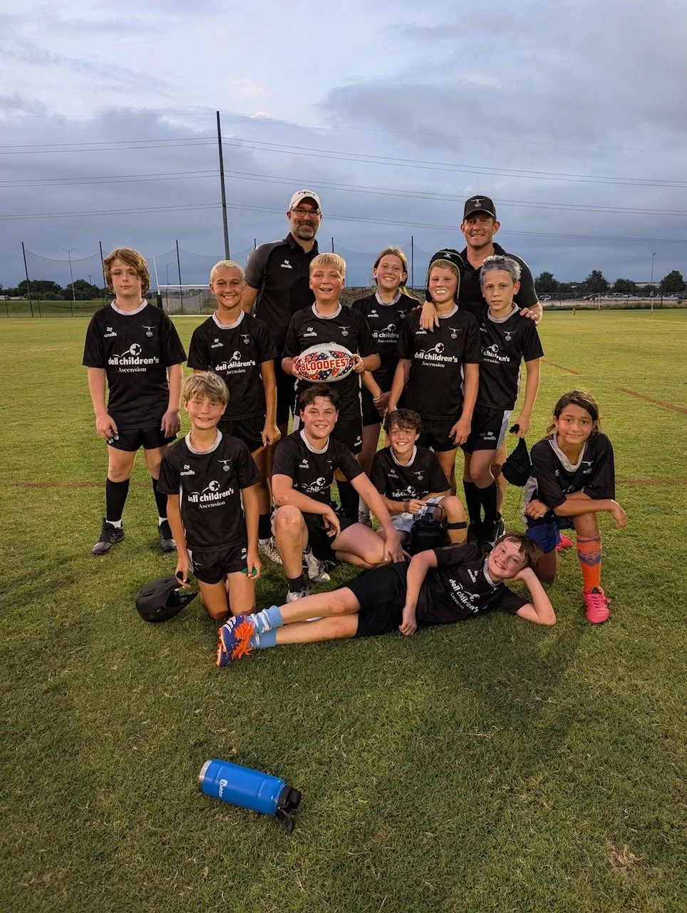 Austin Blacks Youth Rugby players posing for a photo after a match