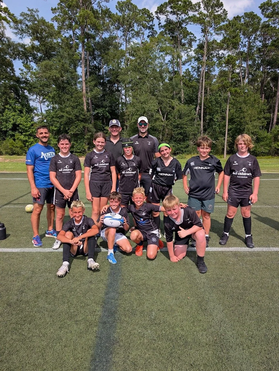Austin Blacks Youth Rugby players posing for a photo after a match