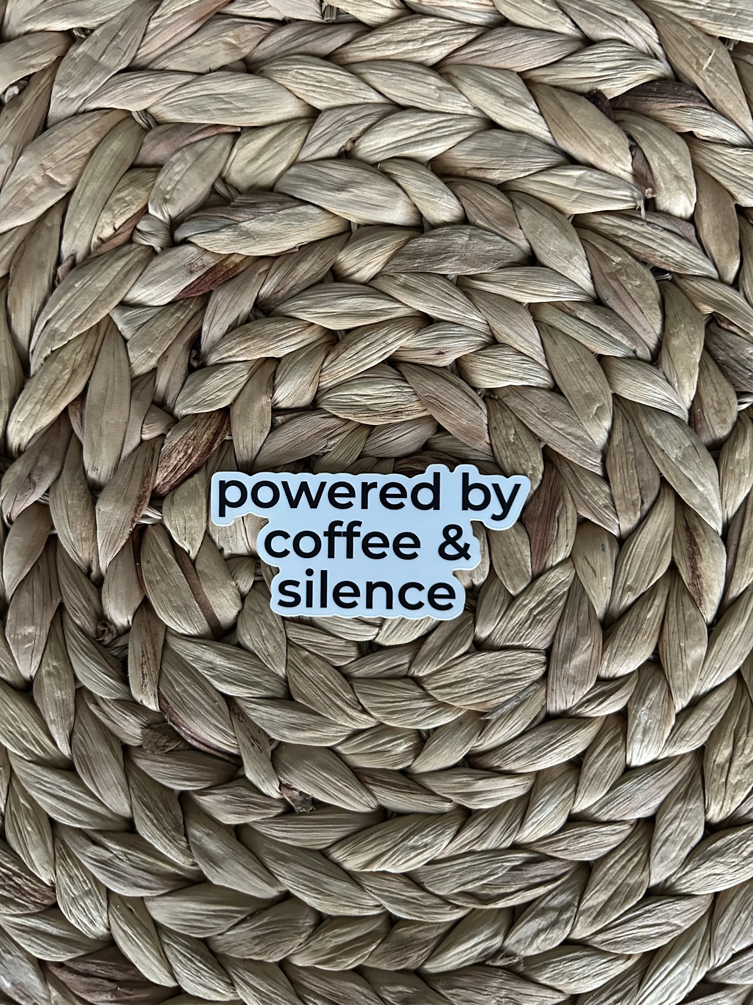 Powered by coffee and silence. — Vinyl Sticker