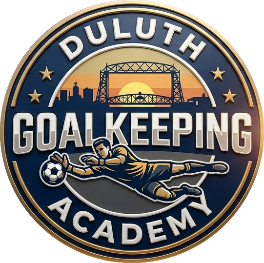 A circular logo for Duluth Goalkeeping Academy featuring a sunset skyline, a bridge, and a soccer goalie diving to catch a ball.