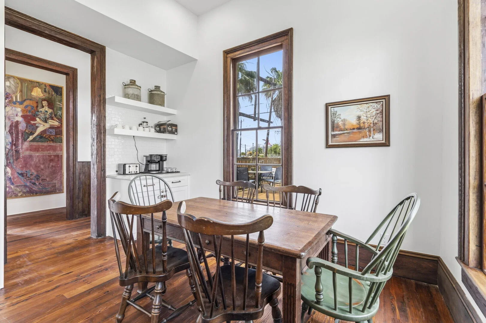 Mollie Walters House Kitchen with a wooden table and chairs, large windows, and coffee bar.
