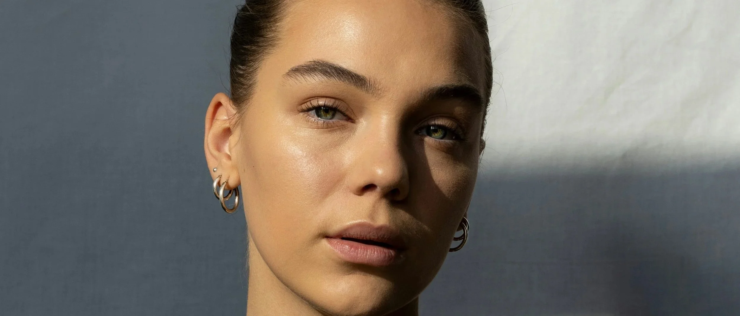 Woman with smooth, glowing skin after a professional Korean facial