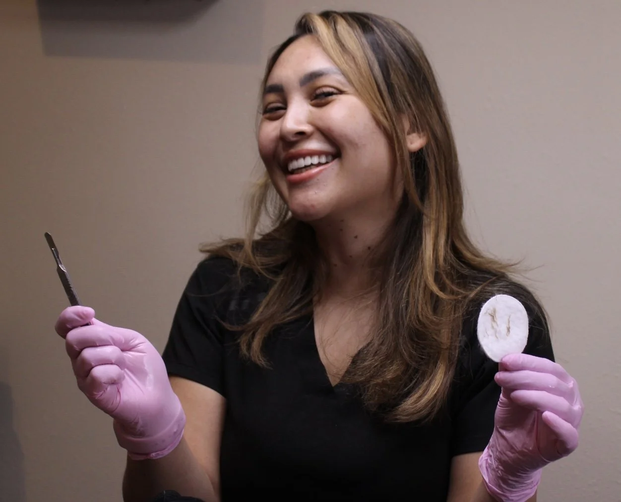 Licensed esthetician preparing professional skincare tools for a facial treatment