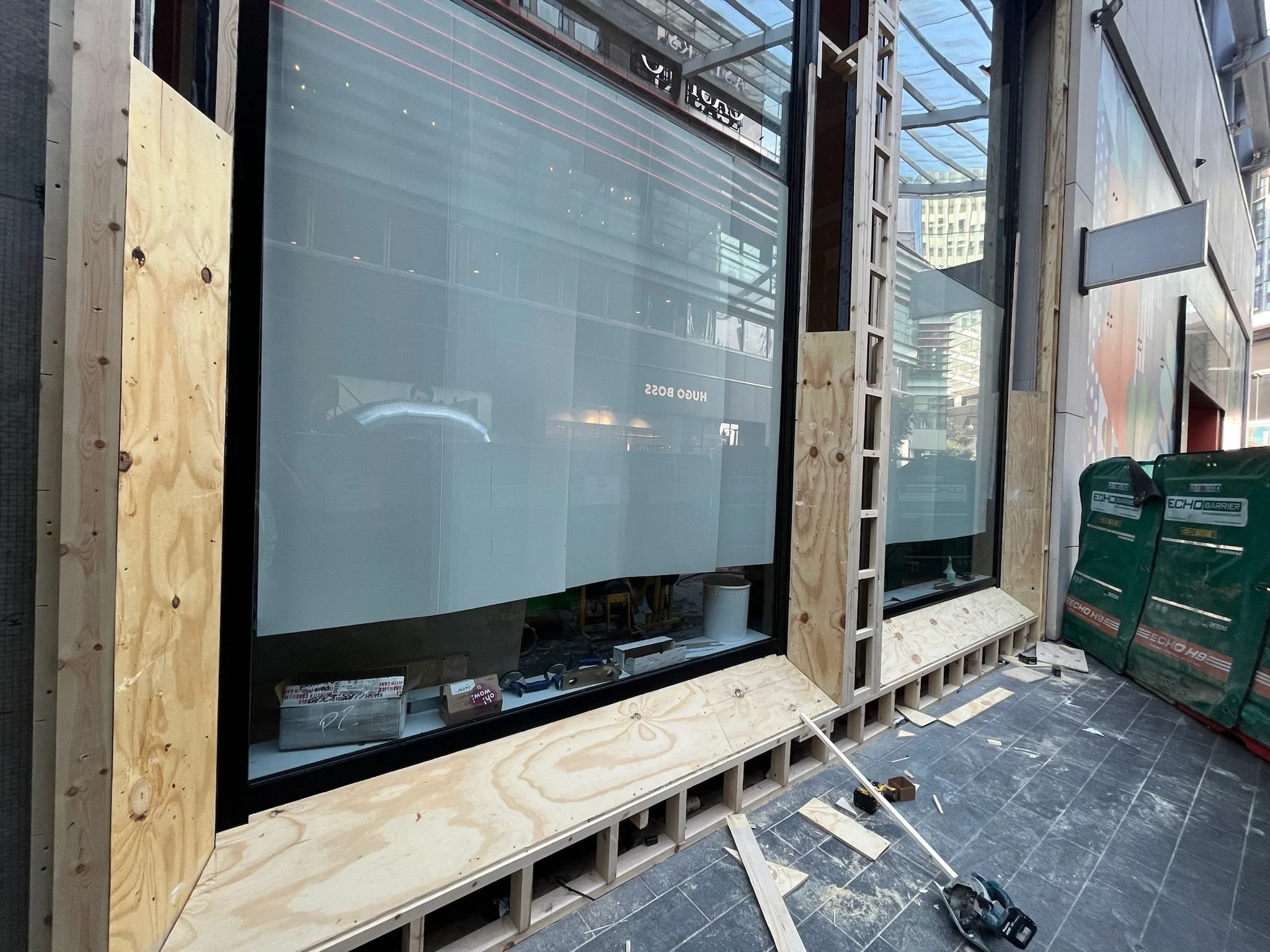 large shop front with angled apertures (Flannels)