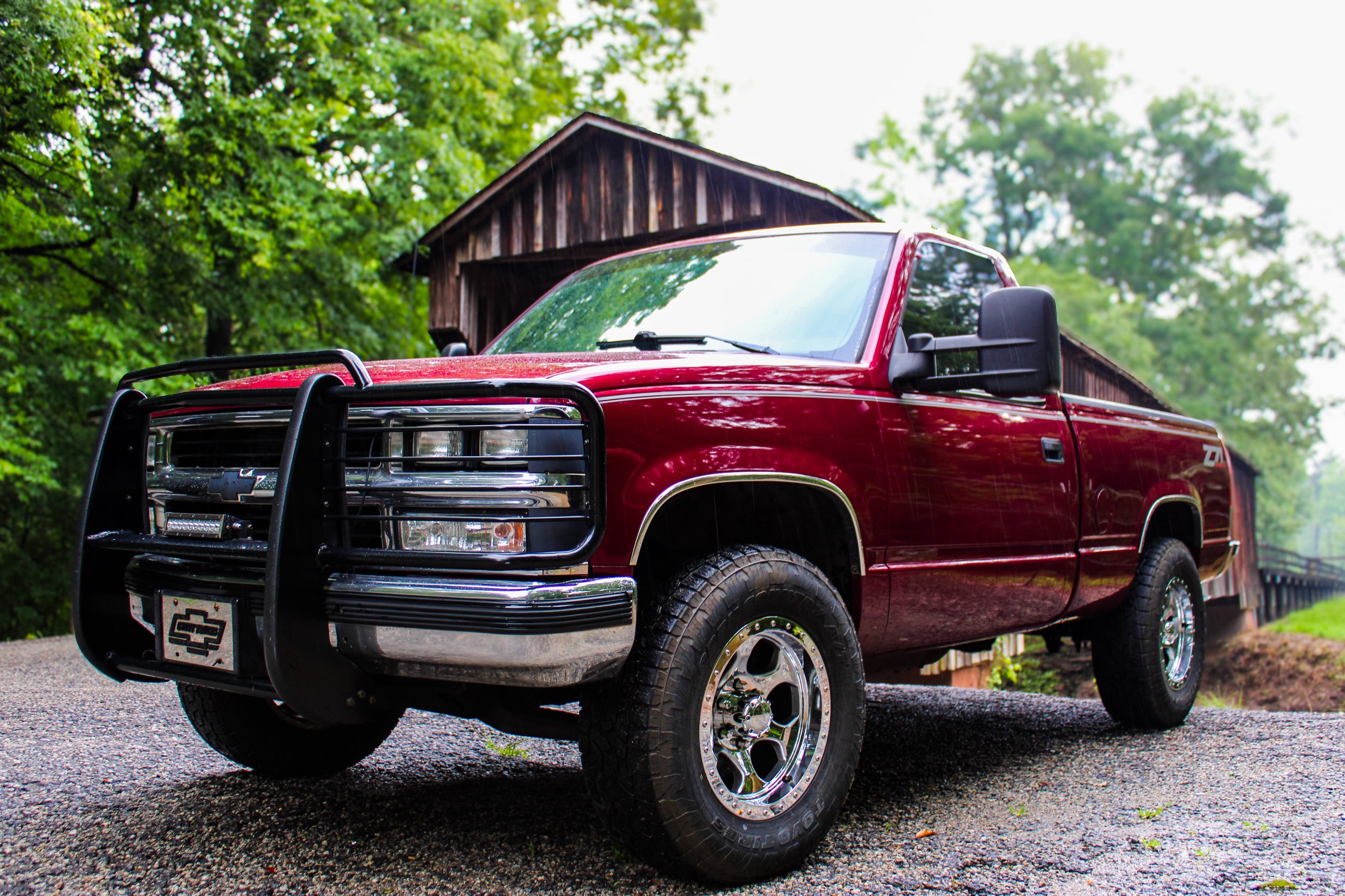 Lifted maroon truck automotive photography in Senoia GA