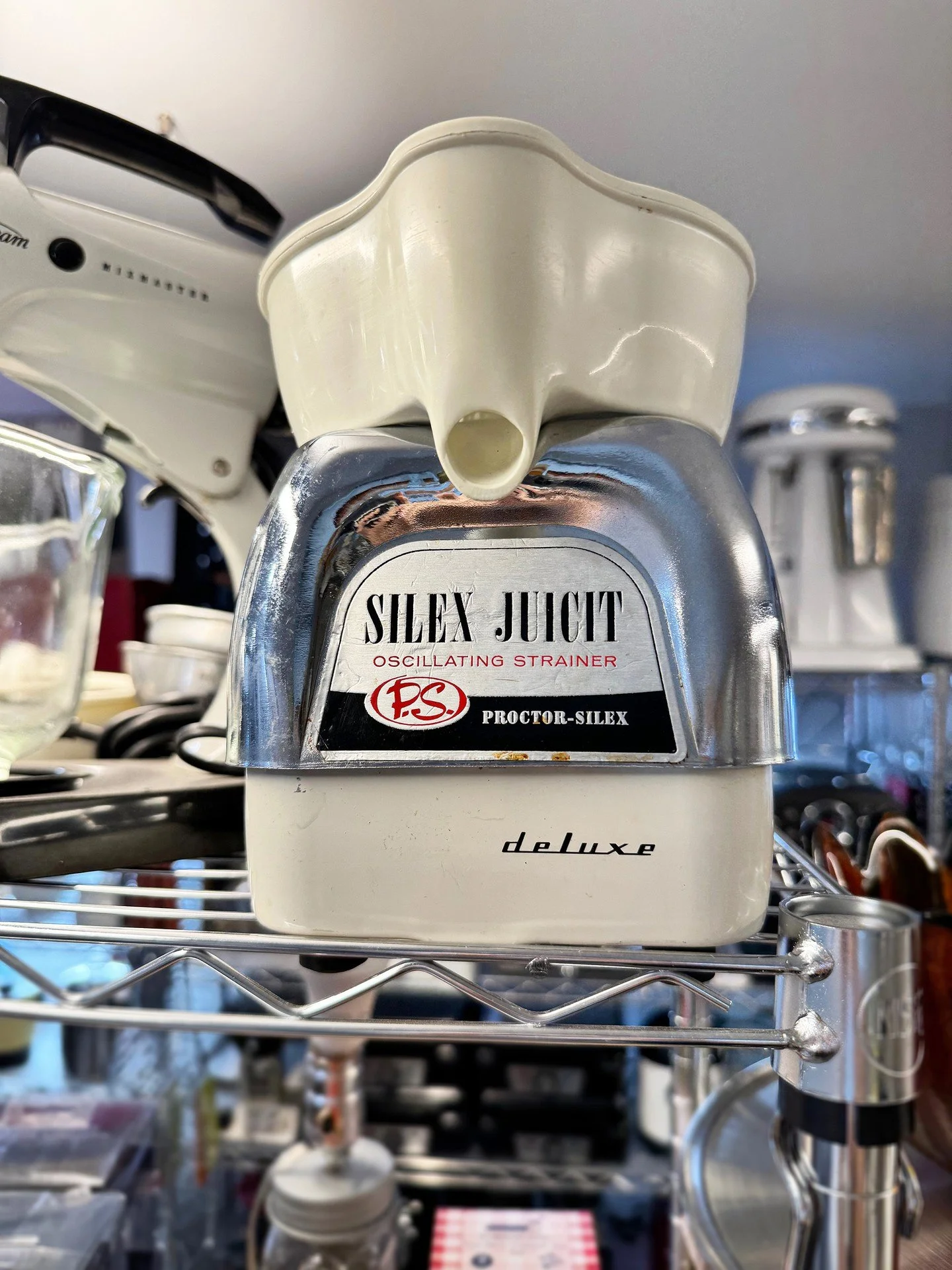 The Silex Juicit &mdash; Proctor-Silex's "oscillating strainer," deluxe, in all its chrome-and-cream glory. Fom back when fresh juice wasn't part of a wellness ritual; it was just breakfast. Built to last, styled to show off, and still read