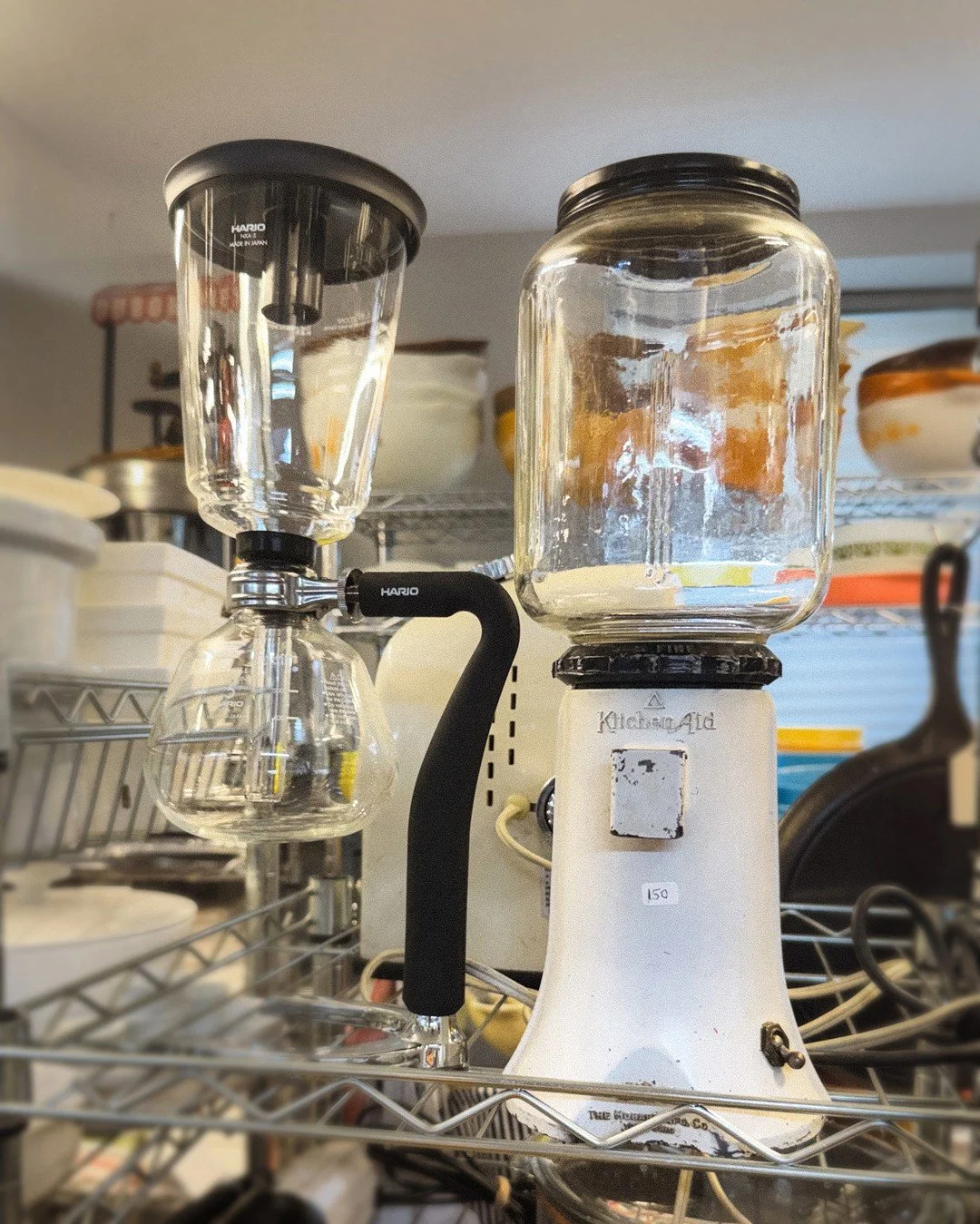 Coffee as theater. A Hario siphon that brews like a chemistry experiment, parked next to a vintage KitchenAid mill built by Hobart &mdash; back when "countertop appliance" meant heirloom. Slow coffee, done beautifully. ⁠
⁠
DM for pricing + 