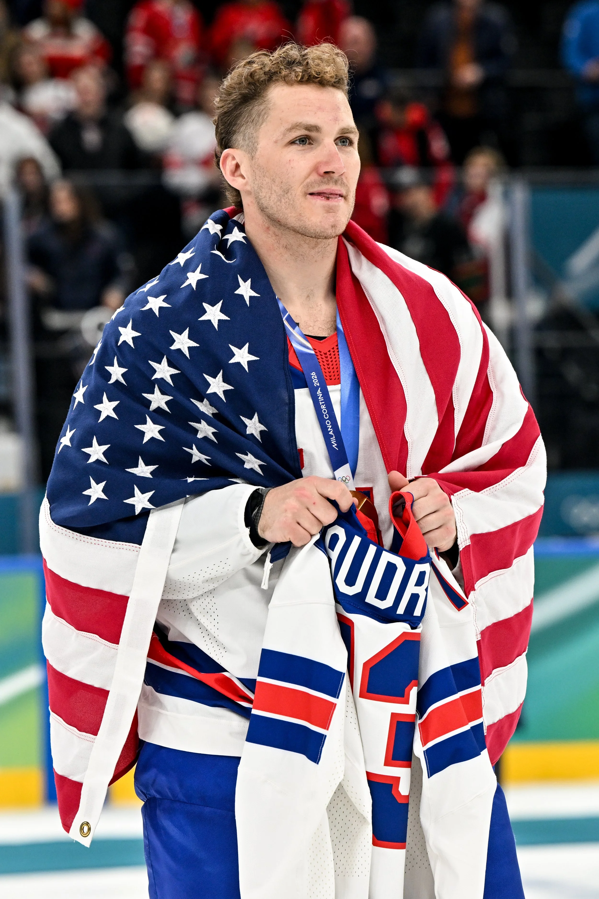  Matthew Tkachuk wears the American flag and holds the jersey of the late Johnny Gaudreau 
