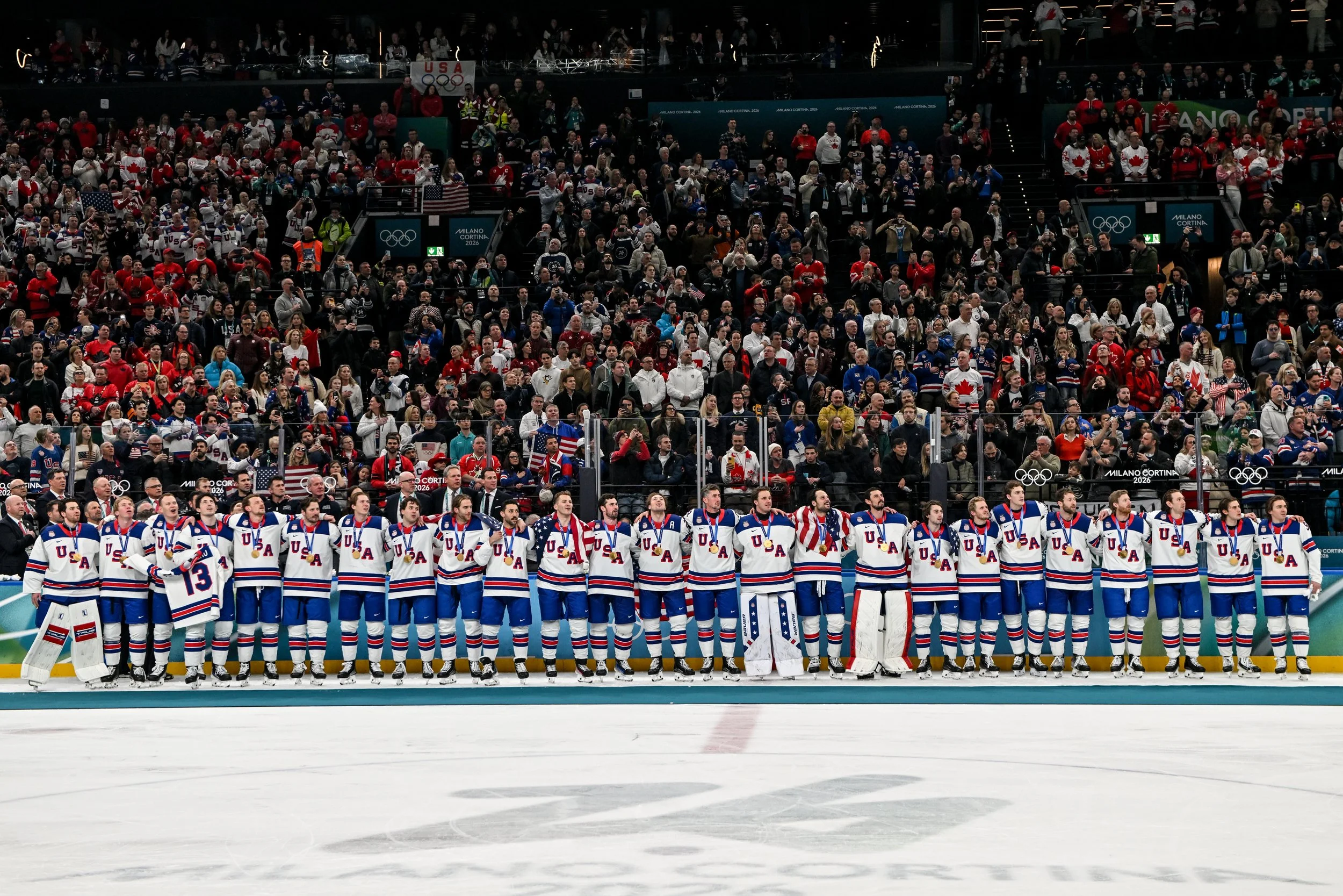  The entire United States team listens to the national anthem after winning gold 