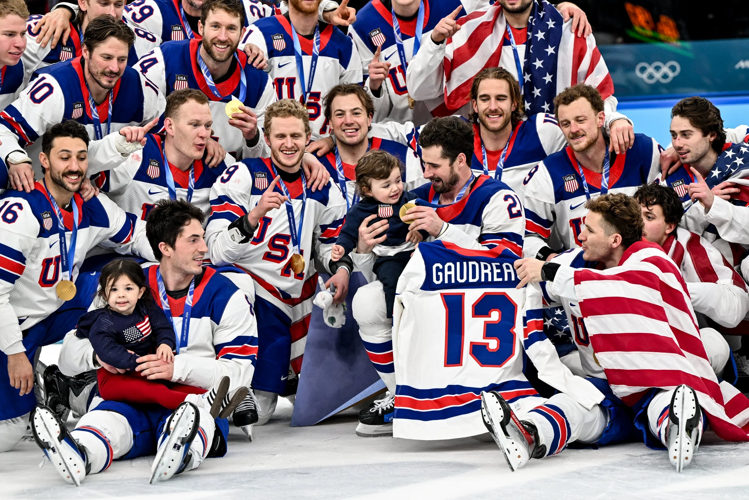  The United States celebrate winning the gold medal alongside the children of the late Johnny Gaudreau 