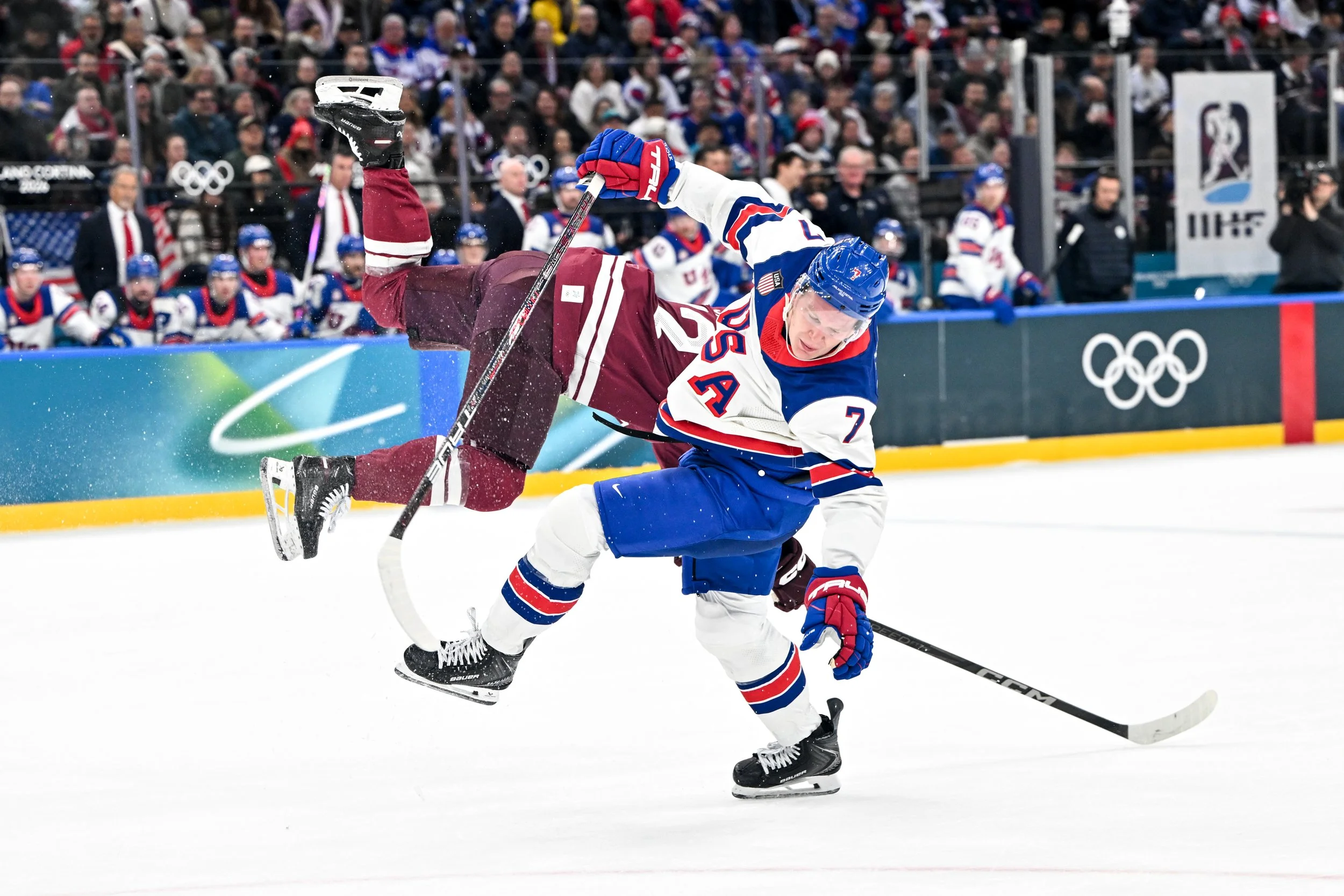  Brady Tkachuk collides with a Latvian player 