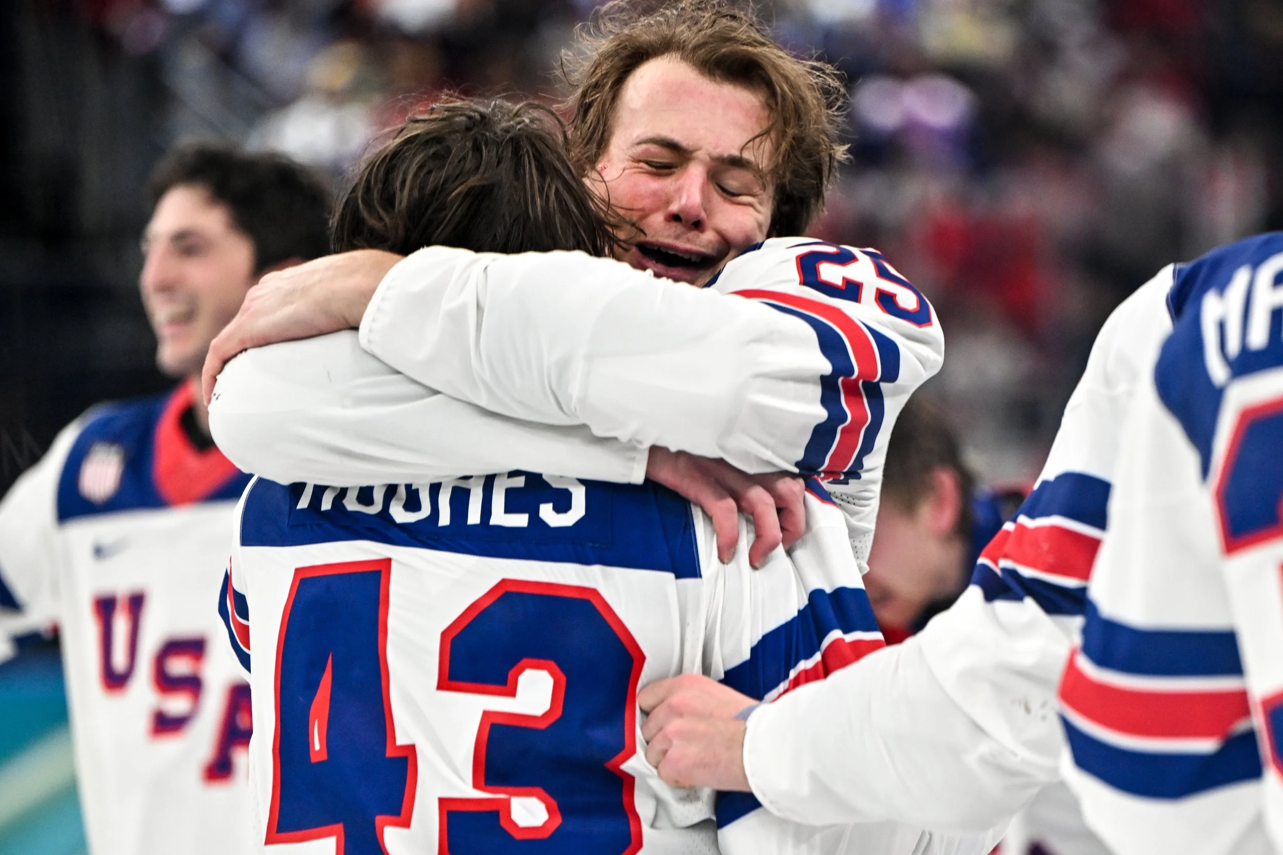  The emotional embrace between Charlie McAvoy and Quinn Hughes after winning Olympic gold 