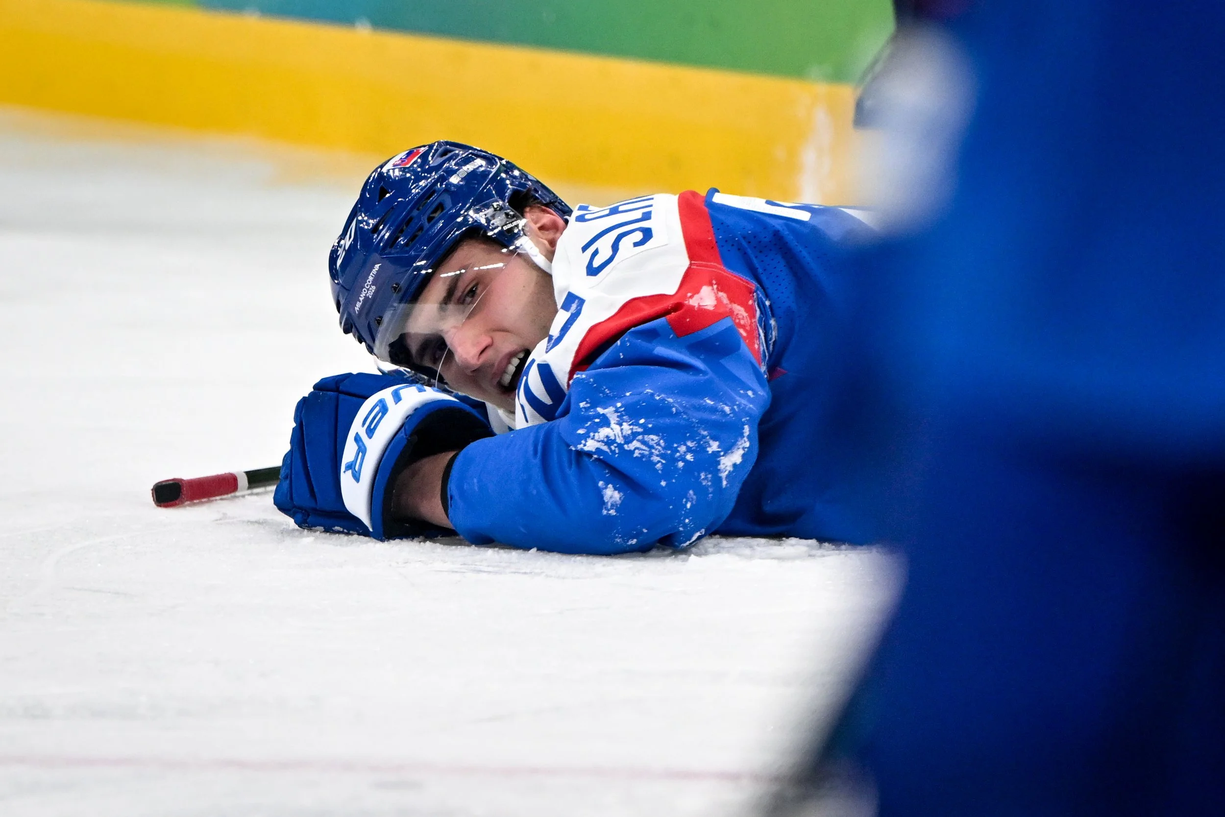  Juraj Slafkovsky reacts in pain after being hit 