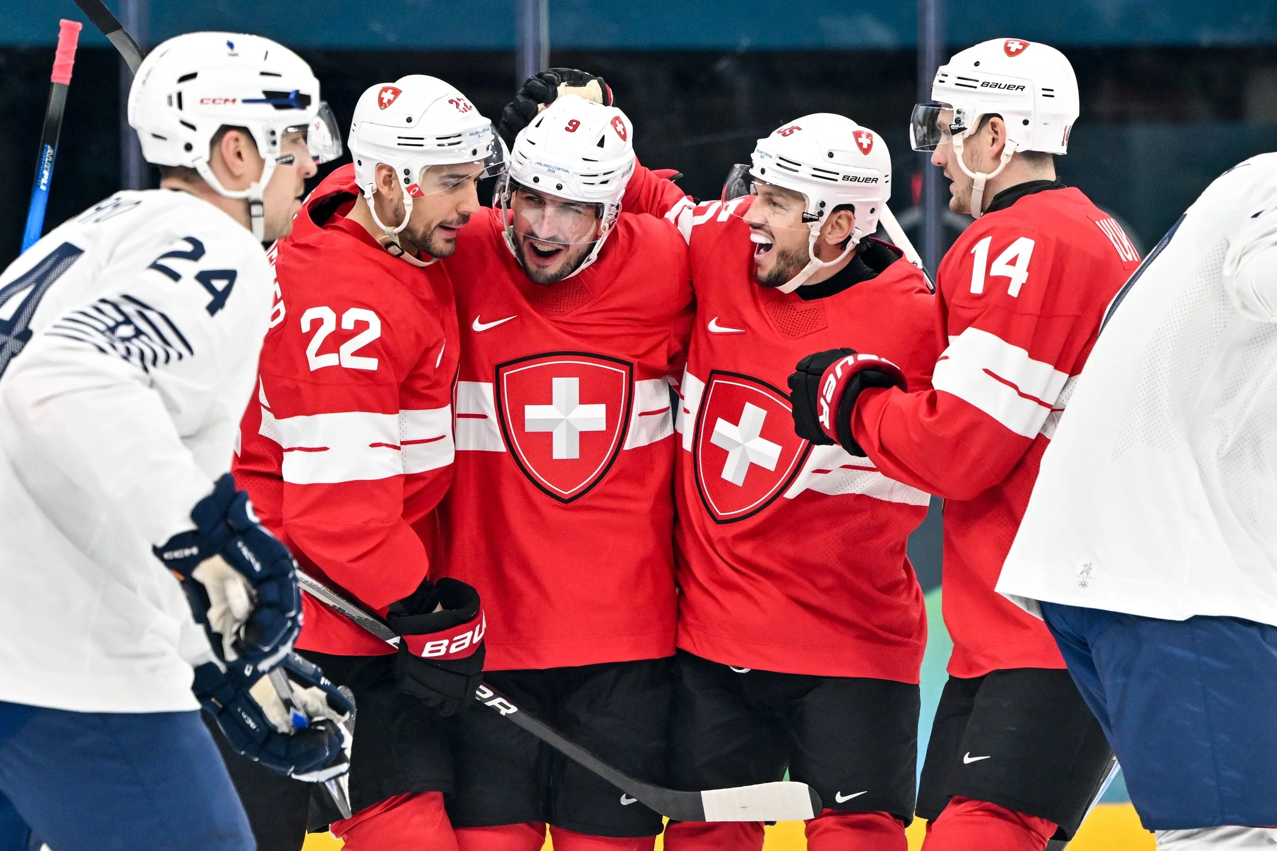  Damien Riat celebrates with his teammates after scoring a goal 
