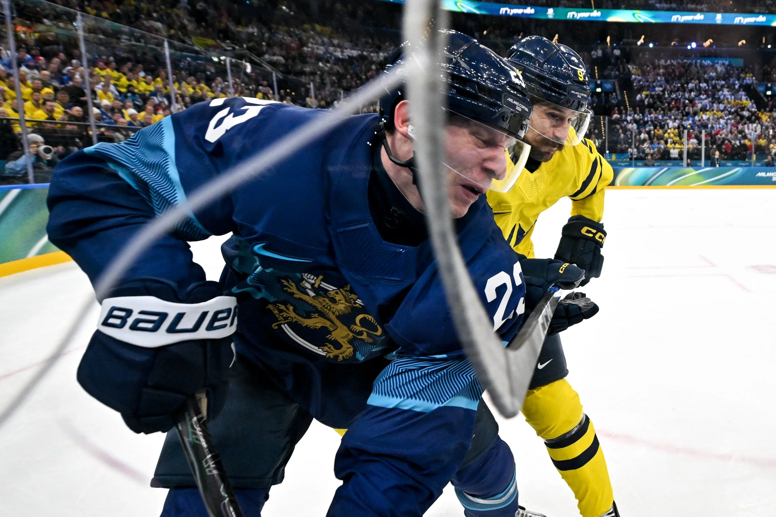 Filip Forsberg and Esa Lindell battle hard along the boards 