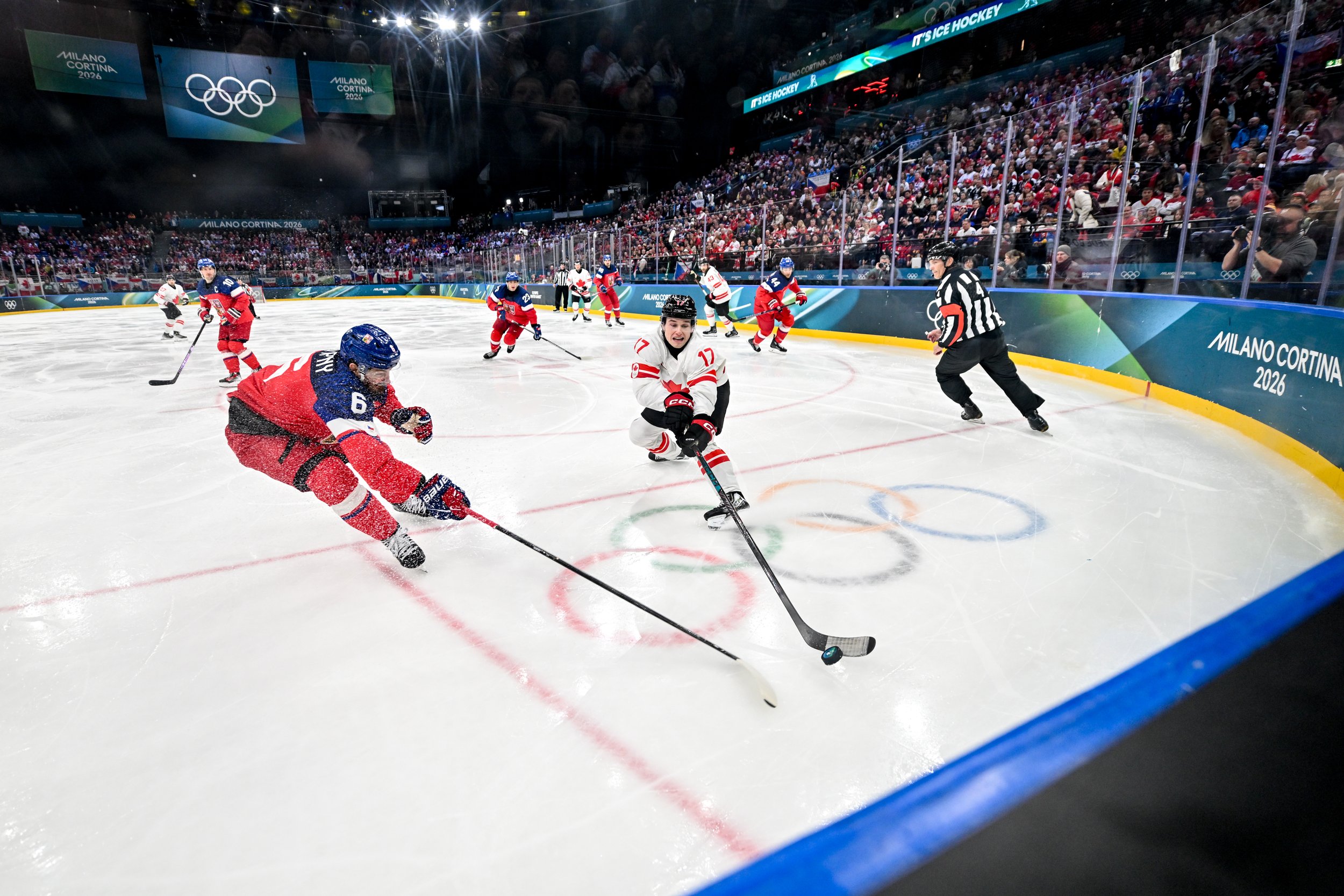  Macklin Celebrini and Michal Kempny battle for possession of the puck 