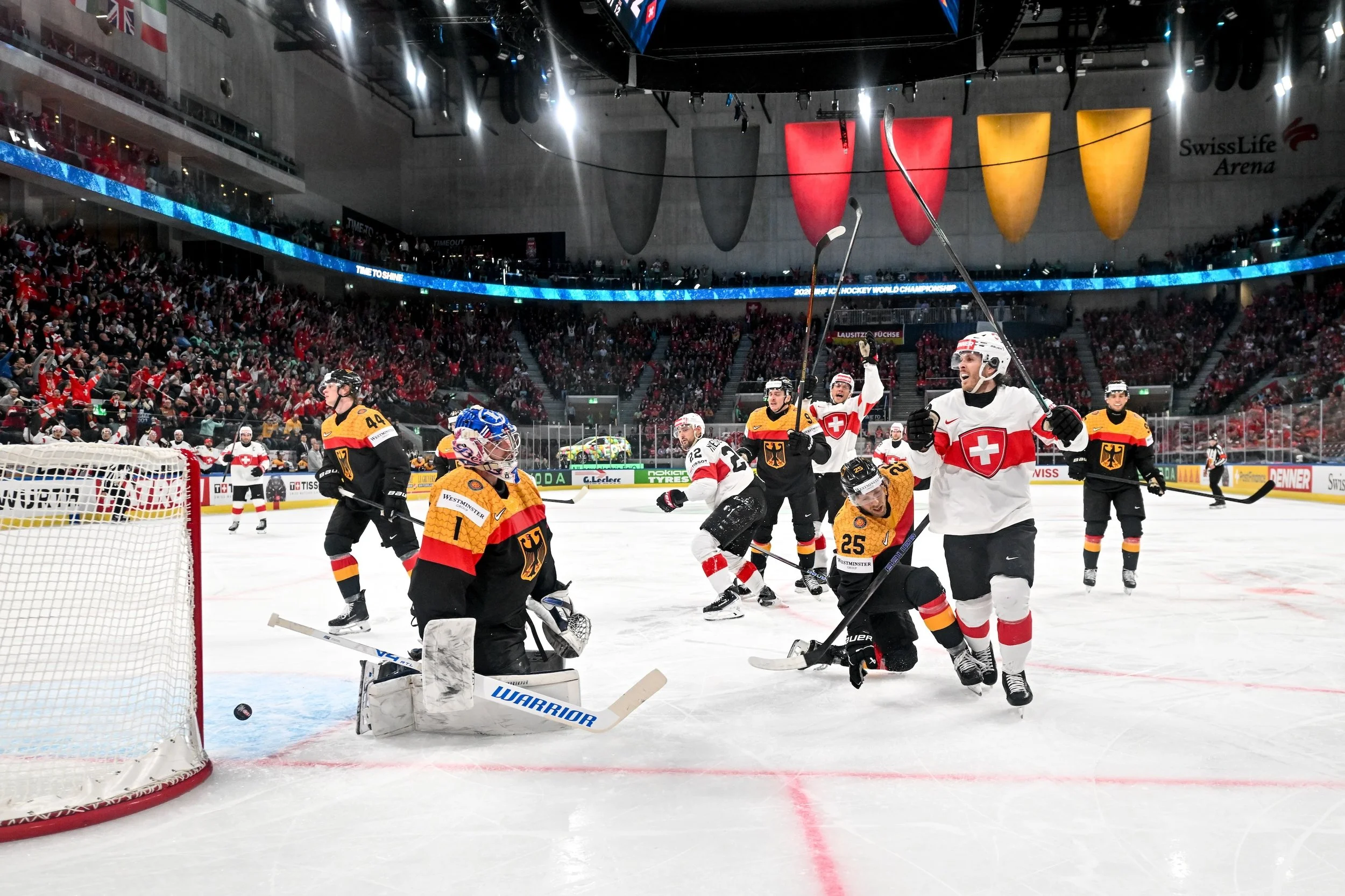  Christoph Bertschy celebrates after scoring a goal against Germany 