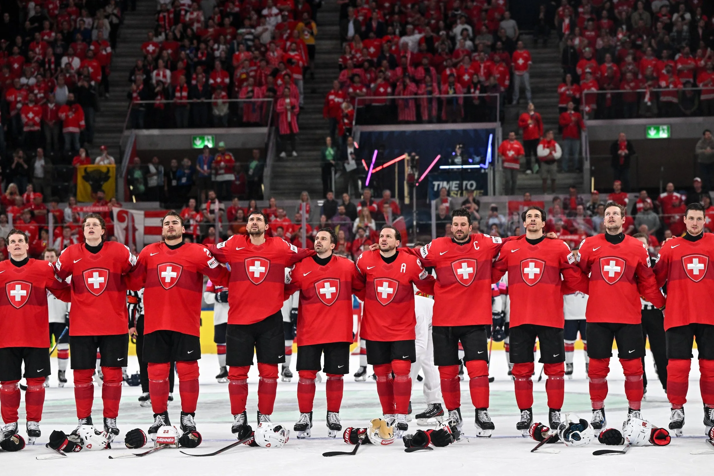  The Swiss players listen to the national anthem after a win 