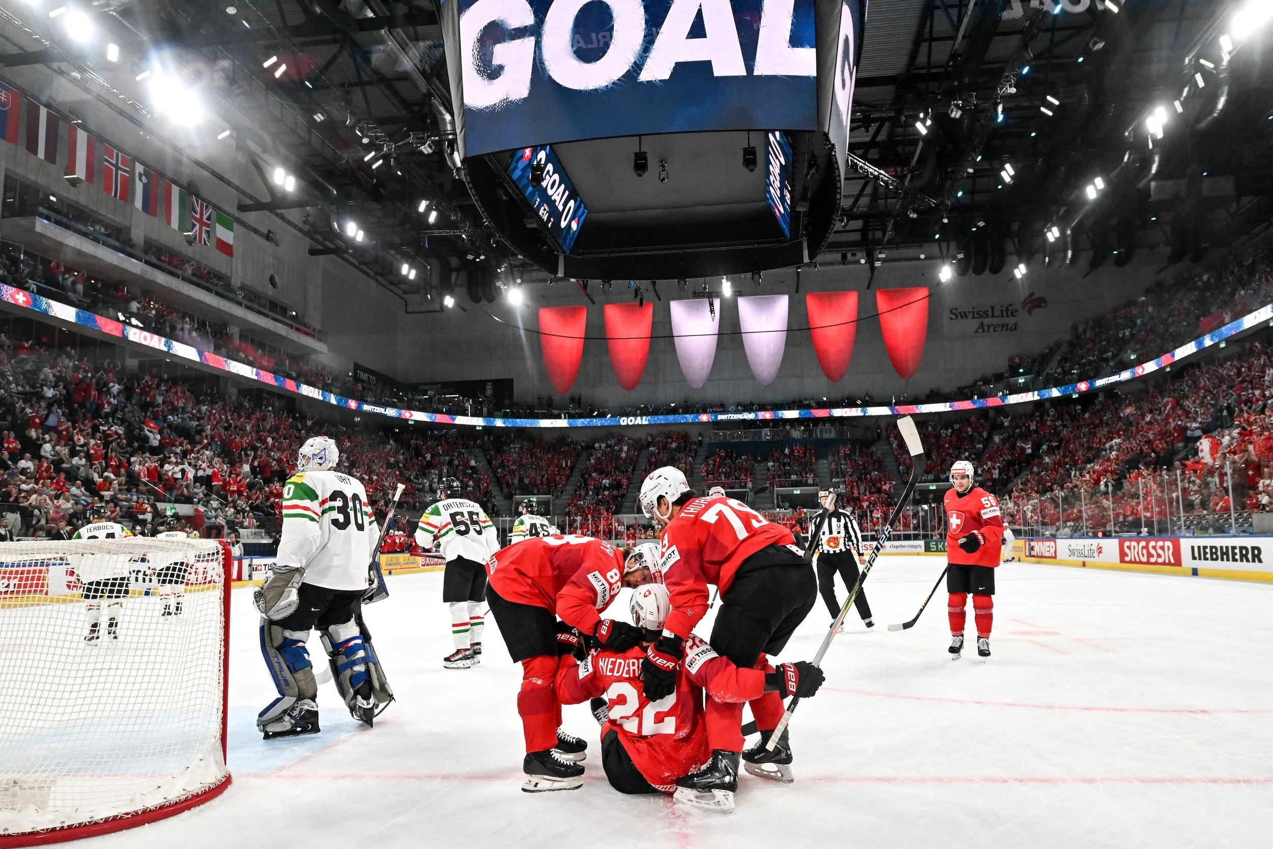  Nino Niederreiter is celebrated by his teammates after scoring a goal 