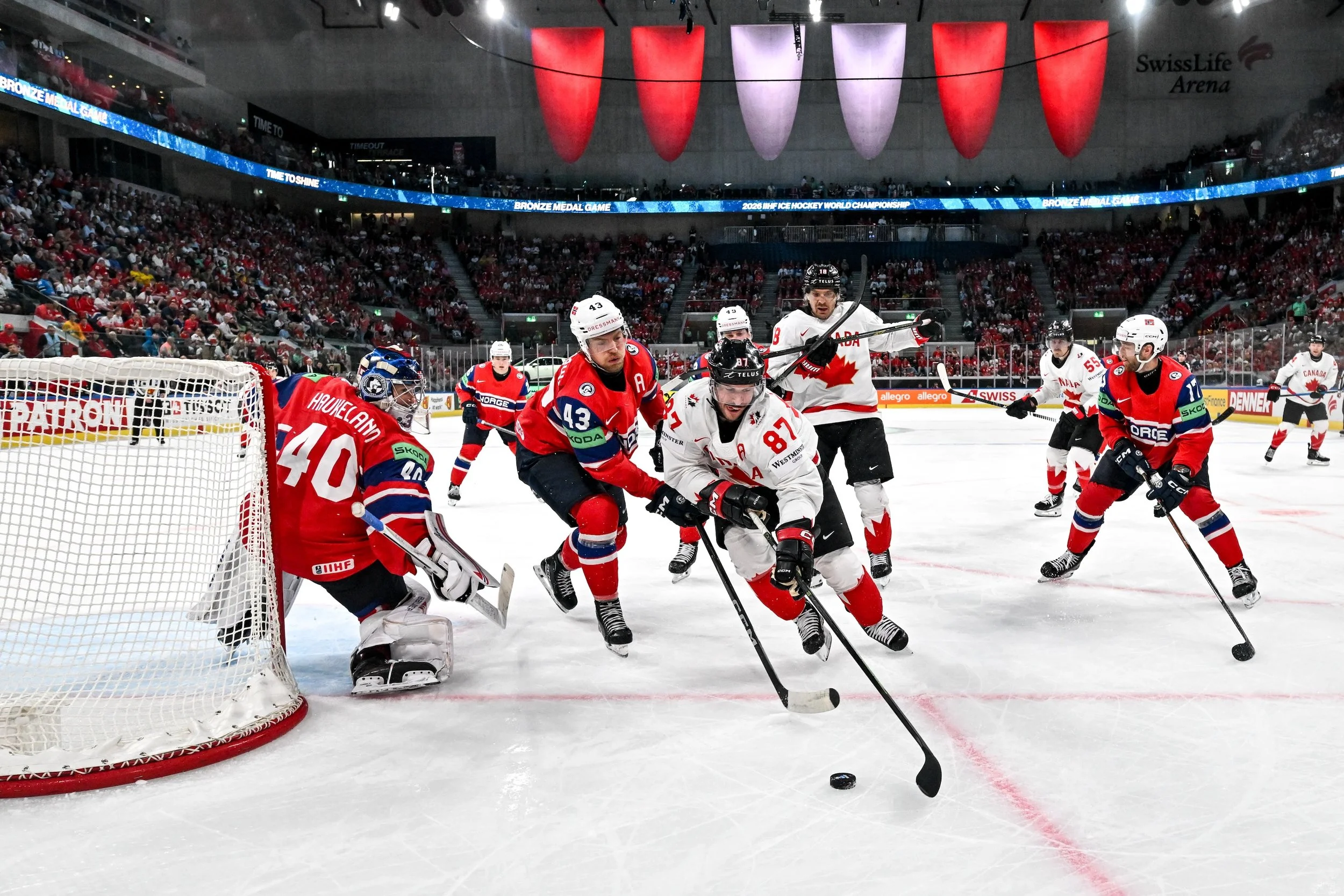  Sidney Crosby battles for the puck against Norway 